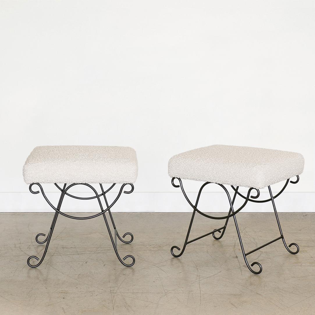 Beautiful iron stool with curved and looped base painted in a matte black finish. Rectangular cushioned seat upholstered in a poodle fabric or can be COM. Multiple available, sold individually.