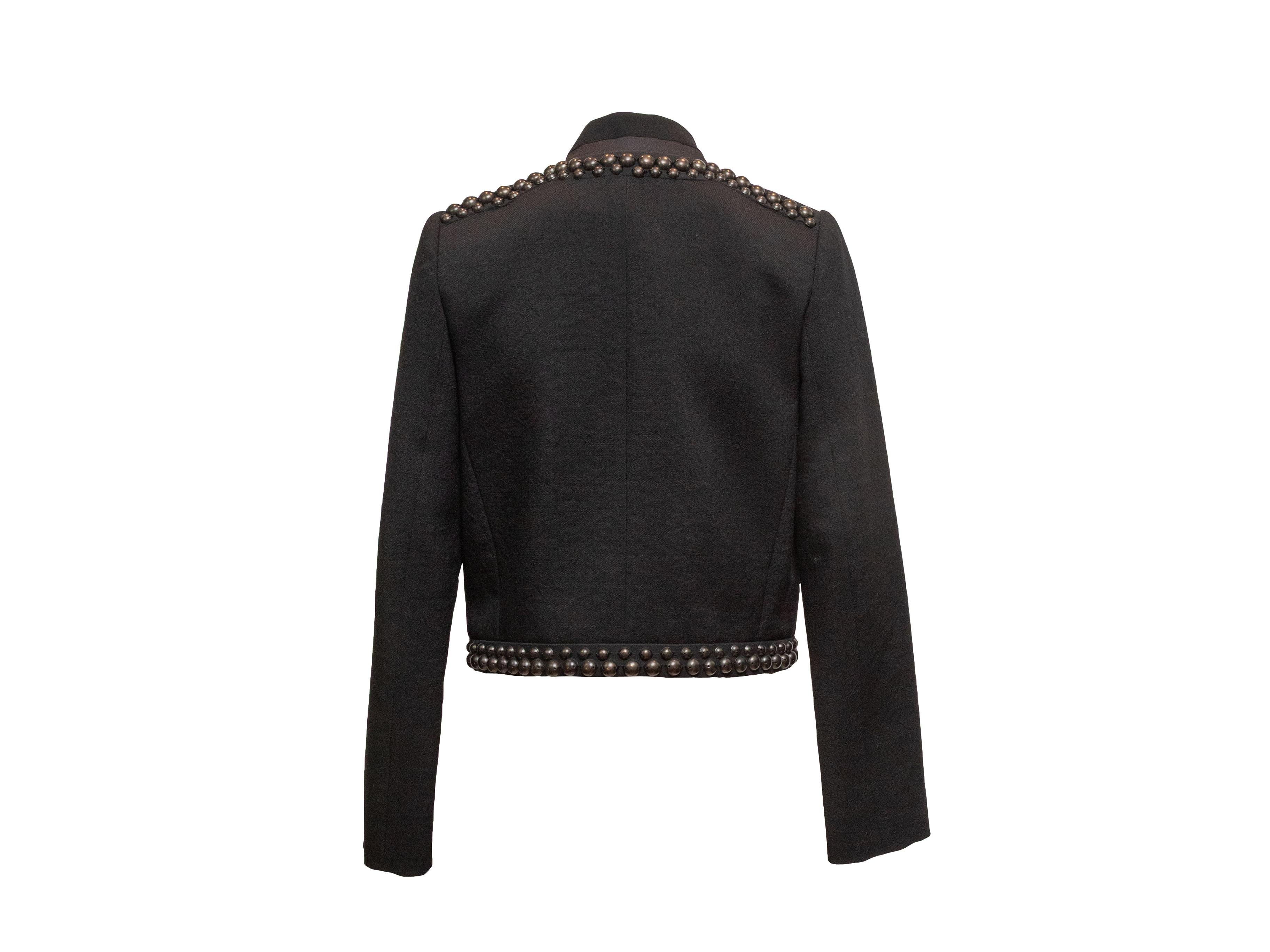 Black studded V-neck blazer by Isabel Marant. Gunmetal hardware. Dual welt pockets at front. Front closure. 32