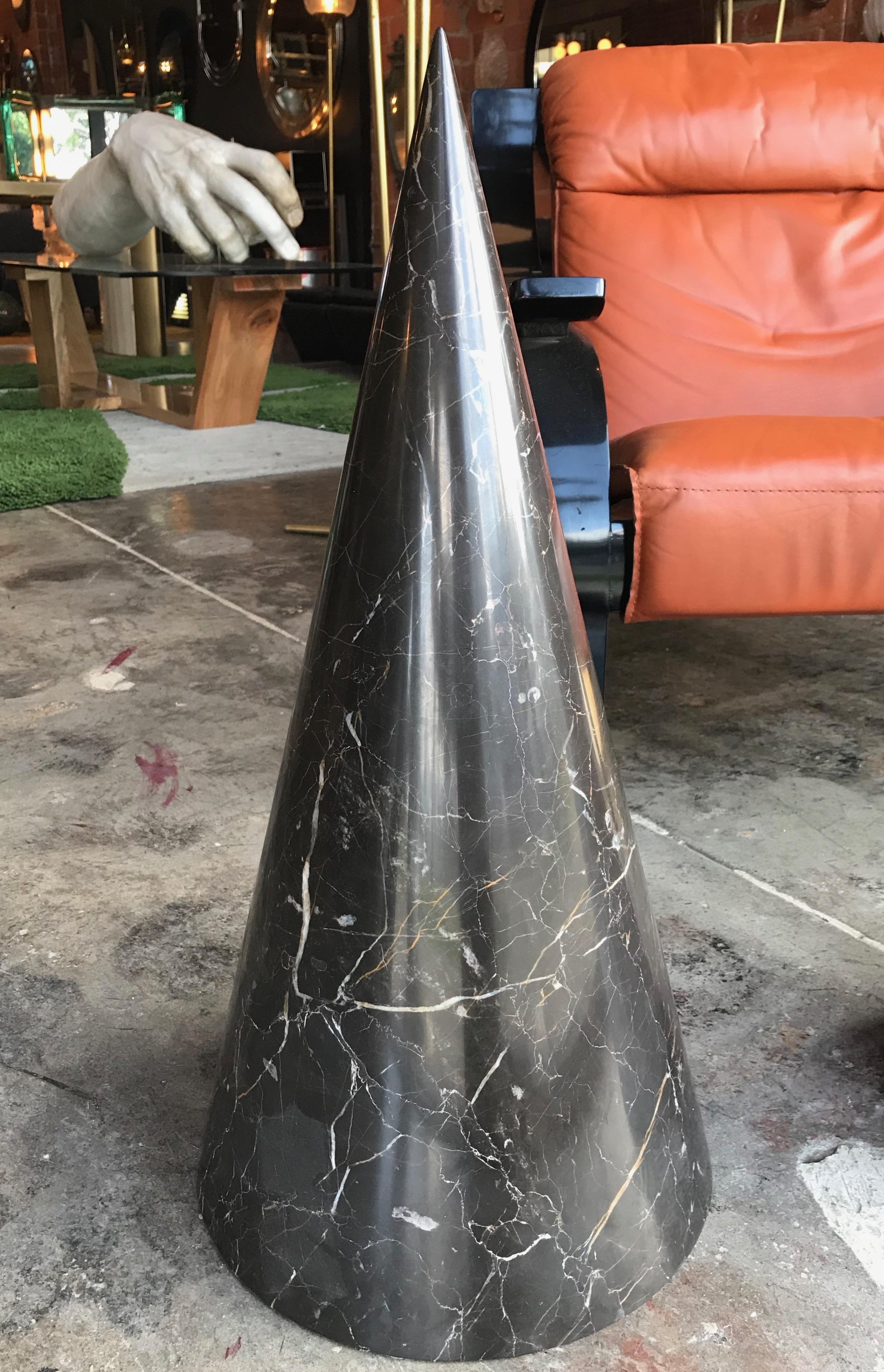 The design is architectural in the sense that the construction is monumental and solid.
The black cone is minimal and powerful at the same time.
Perfect for in-out door decoration.
Italian marble.