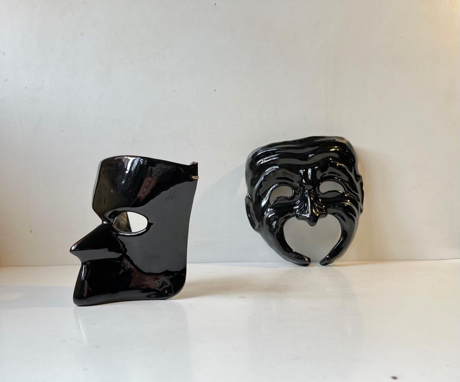 A set of ceramic masquerade wall masks (male+female) made in Venice in 1982 and bought in the museum shop at Galleria Giorgio Franchetti that houses in the famous Ca'd'Oro at the Grand Canal in heart of Venice. Measurements: 18x16 cm and 14x13 cm.