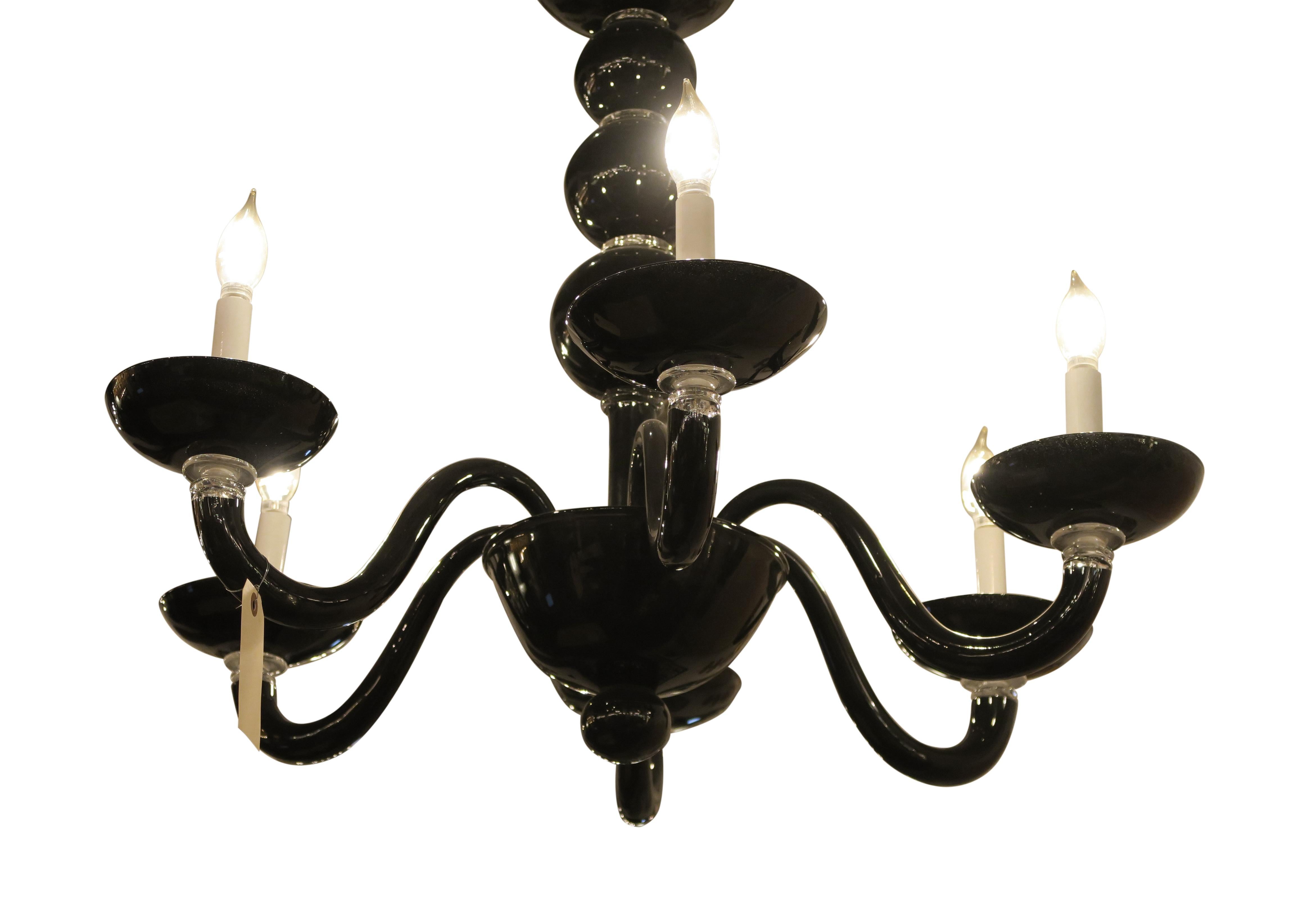 Black Murano glass Mid-Century Modern style six arm chandelier from Italy. This can be seen at our 2420 Broadway location on the upper west side in Manhattan.