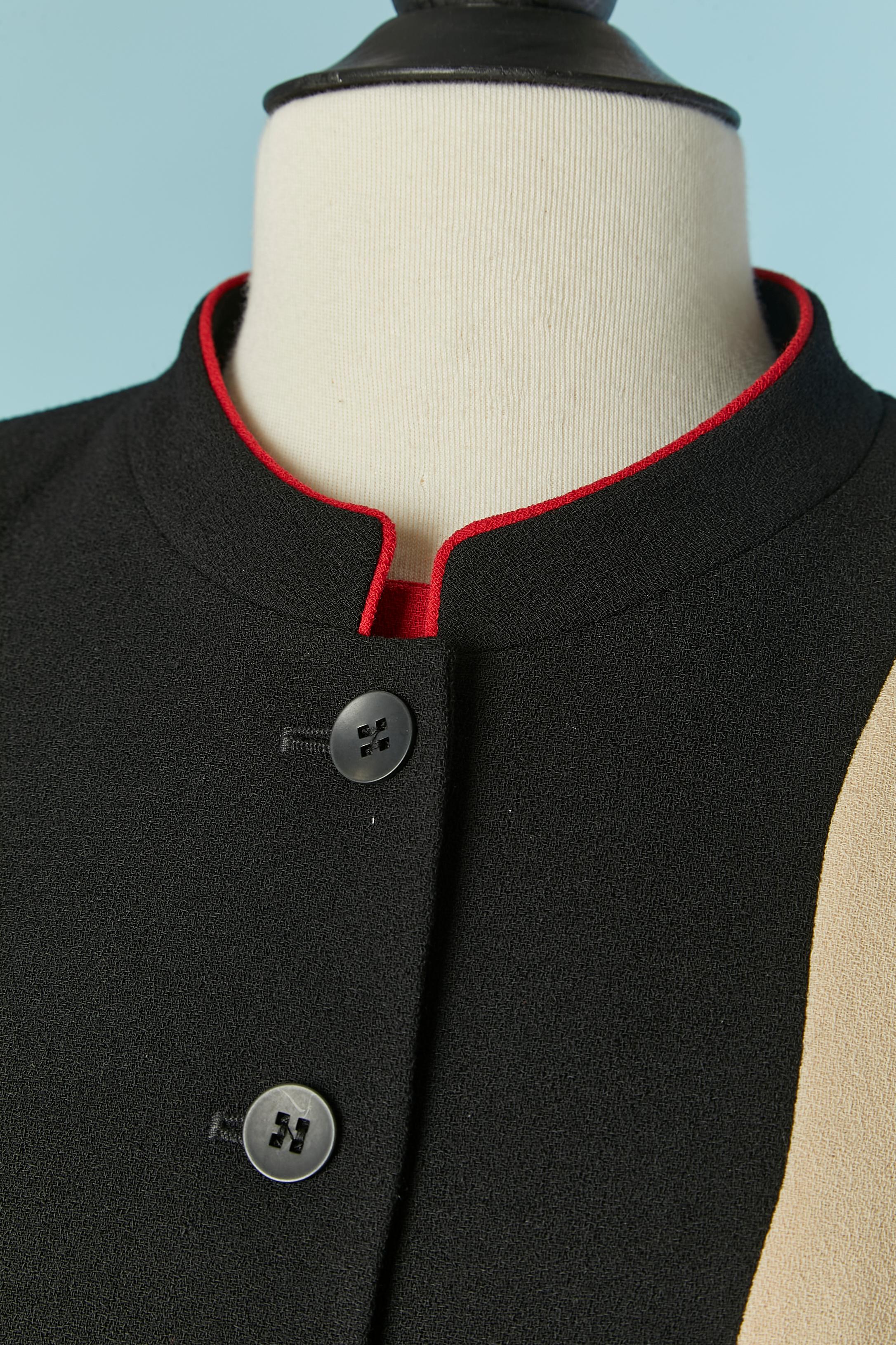 Black jacket and dress ensemble in wool. Rayon lining. Shoulder pad. inside the jacket and dress. 
Button and buttonhole closure on the middle front. 
Invisible zip closure on the middle back on the dress. 
SIZE 40 (Fr) 8 (US) M 