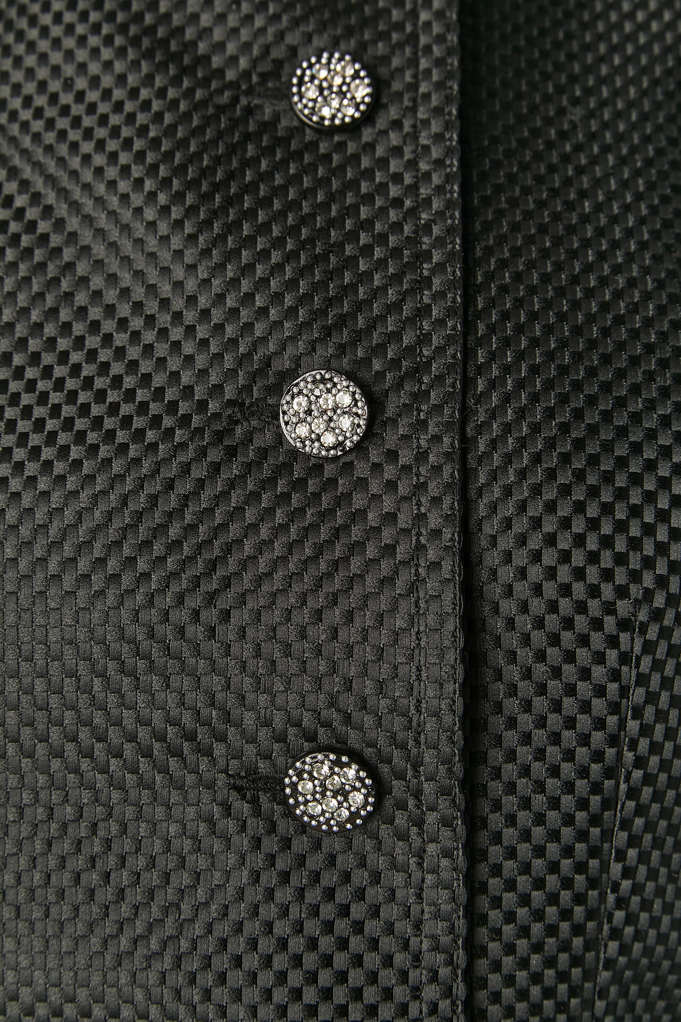 Black jacket and dress ensemble with mini check pattern. 
Main fabric composition: 100% polyester. 
Lining ( inside the dress bustier only) probably rayon or acetate. Boned inside the dress bust. Split on the back of the dress, lenght: 26cm and