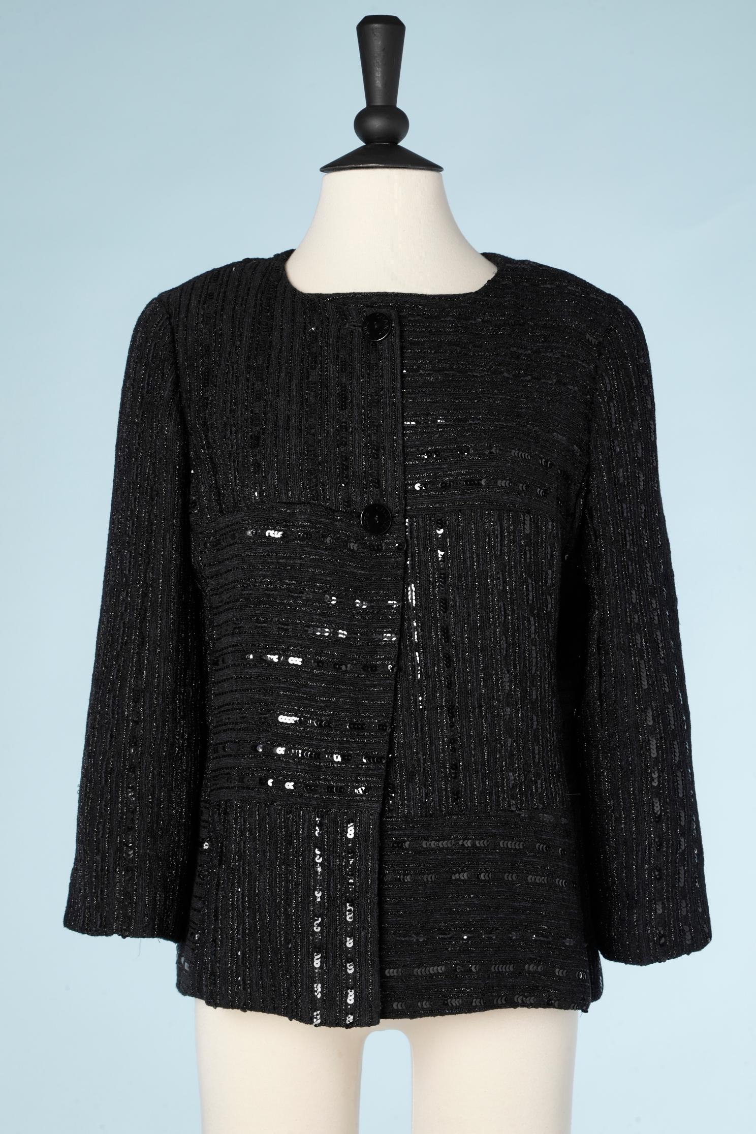 Black jacket and top ensemble in wool, lurex and sequins. Black branded silk lining on both items. Branded buttons. 
SIZE 40 ( M) 