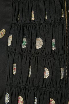 Black jacket and trouser ensemble with embroideries and gather Chanel