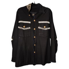 Veste noire vintage d'époque militaire américaine, boutons dorés et franges de taureau tressés