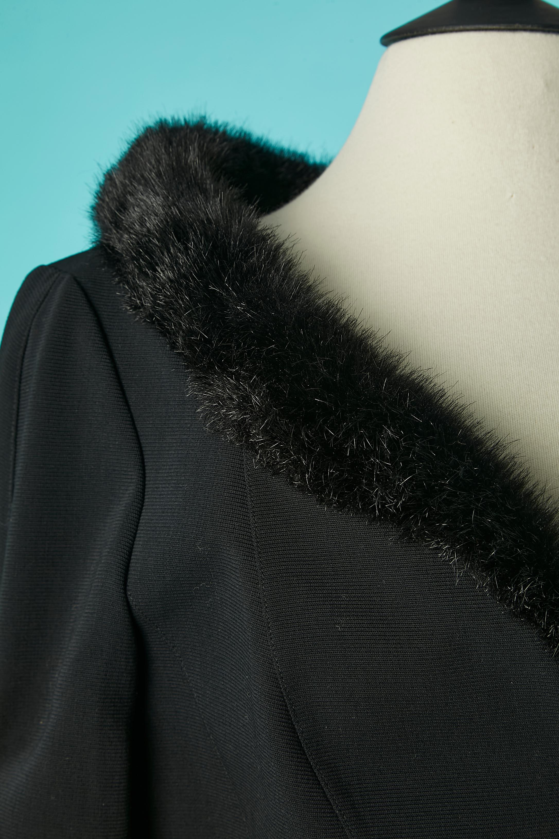 Black single breasted jacket with fake furs collar and gathered sleeves. Main fabric: wool. Snap closure in the middle front. 
SIZE 40 (Fr) 10 (Us) L 