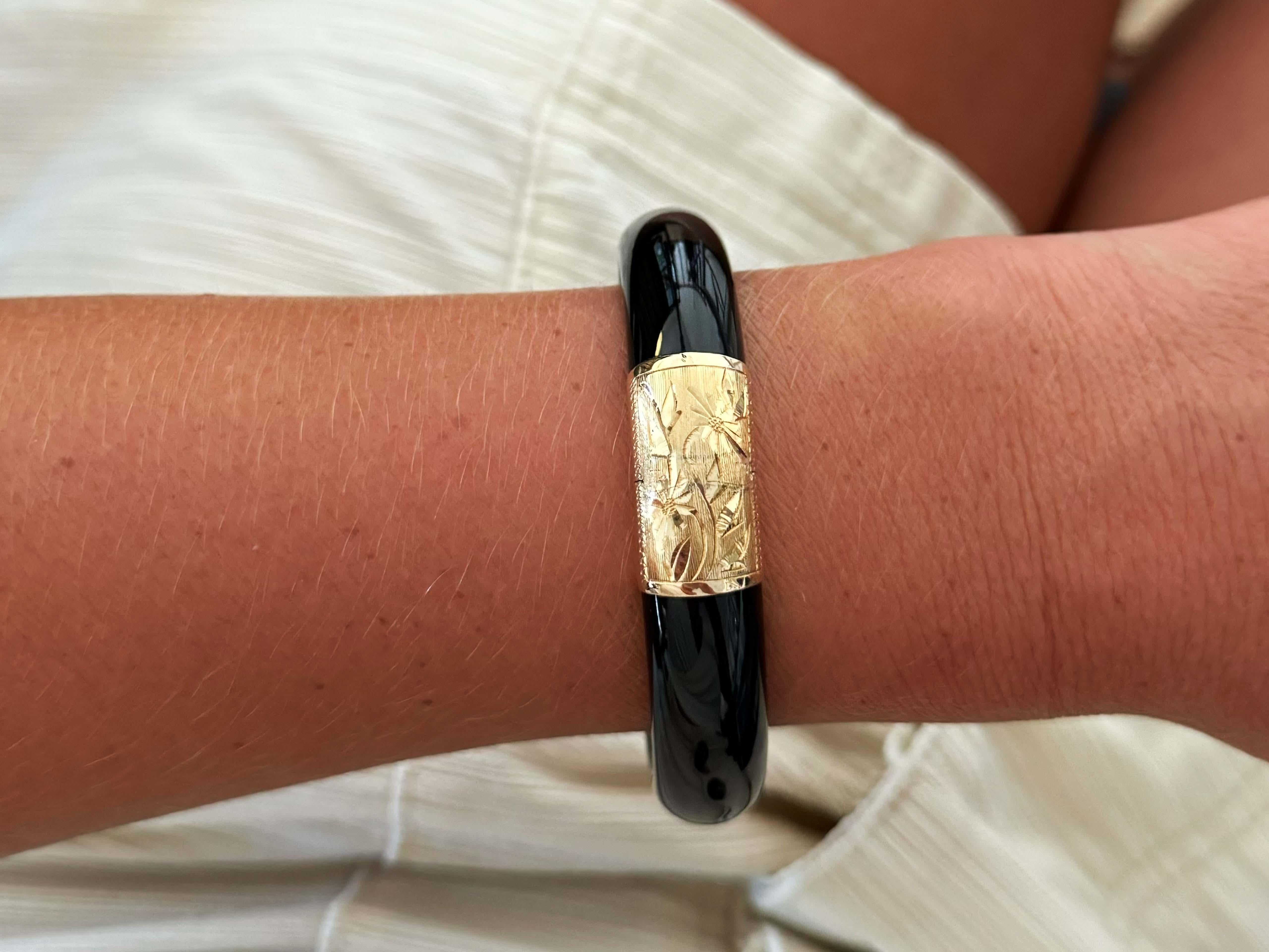 Specifications:

Metal: 14k Yellow Gold

Total Weight: 57.3 Grams

Bracelet Circumference: ~7.0