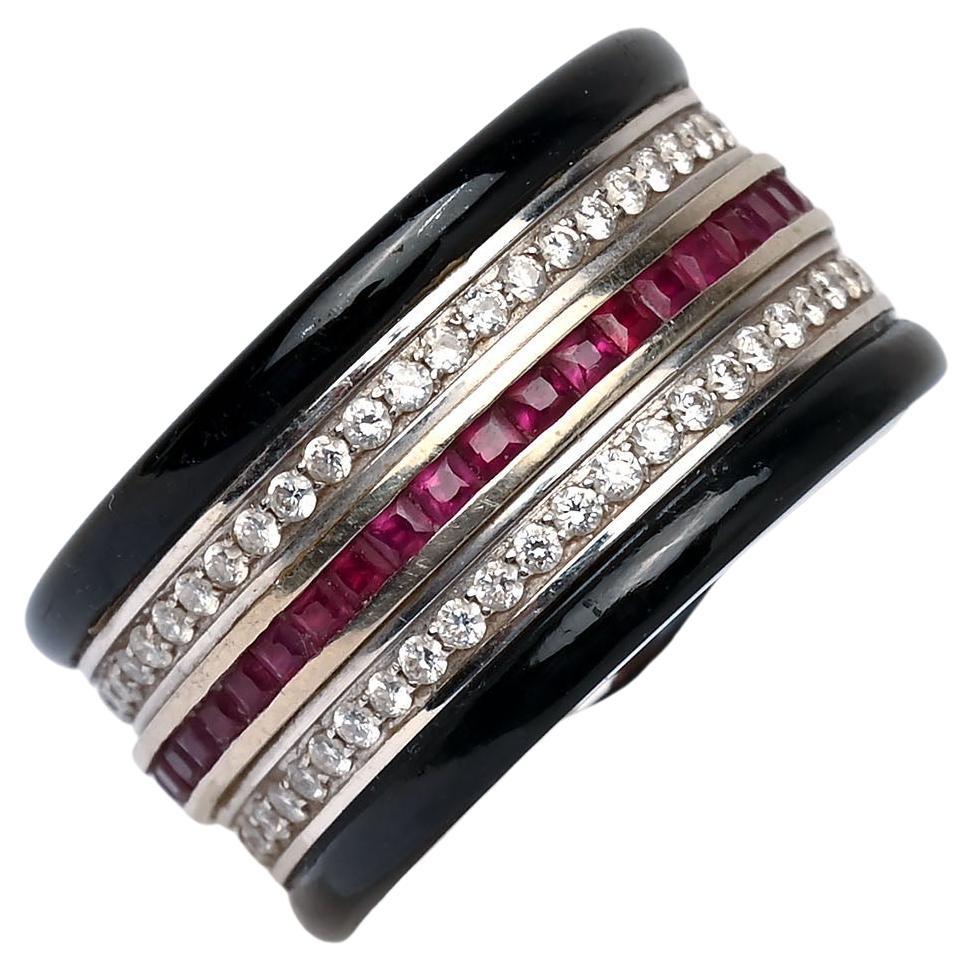 Striking and unusual band ring with black jade top and bottom; a row of rubies in the center and a row of diamonds on either side.  Inscribed inside the ring is the name of the maker, the late Edward Chiu. In addition, he has written all of the