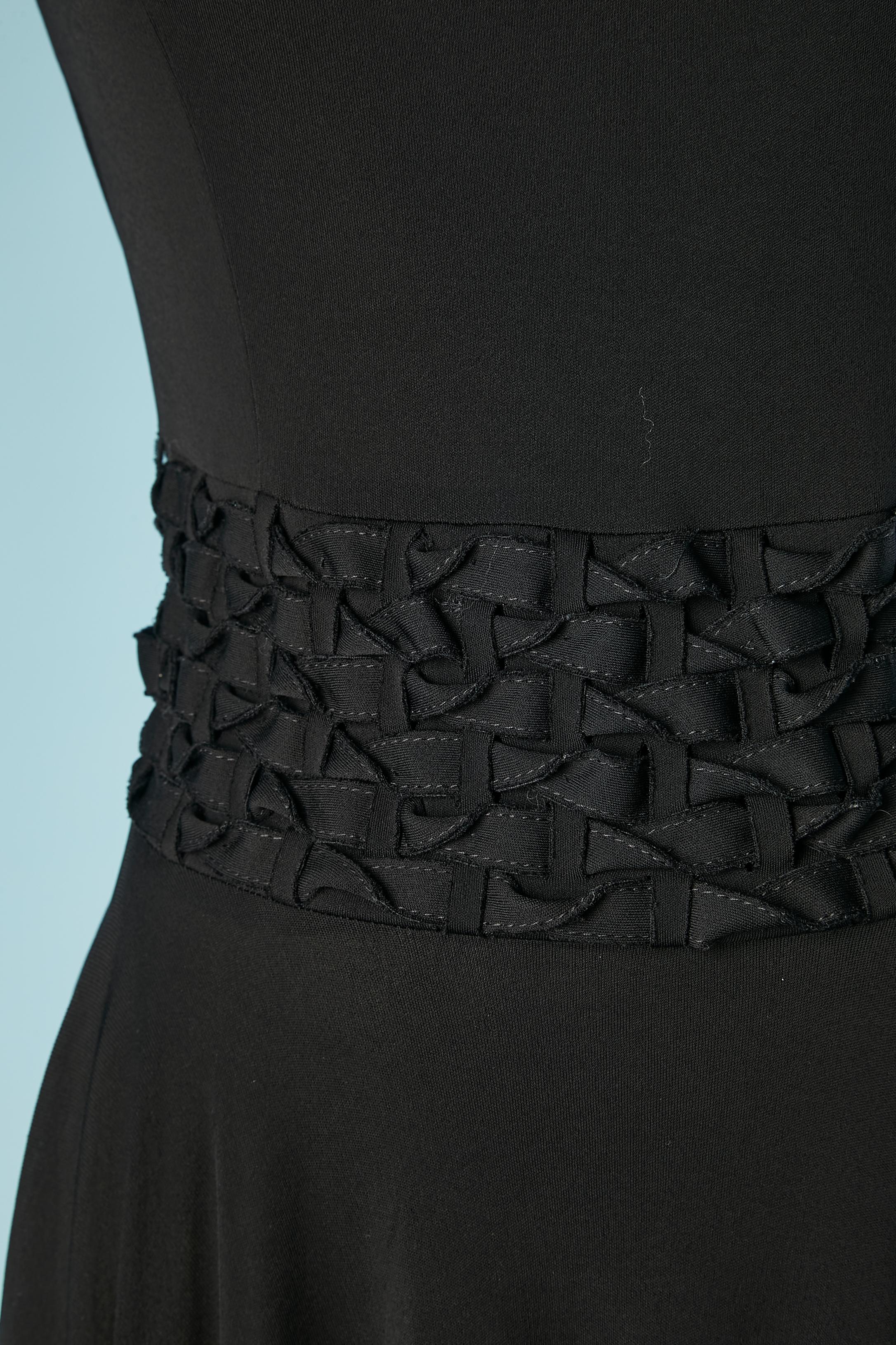 Black jersey cocktail dress with fabric strips braided belt. Fabric composition: rayon
Snap on the left side of the waist to close the belt. 
SIZE 36 (Fr) 6 (US) M 