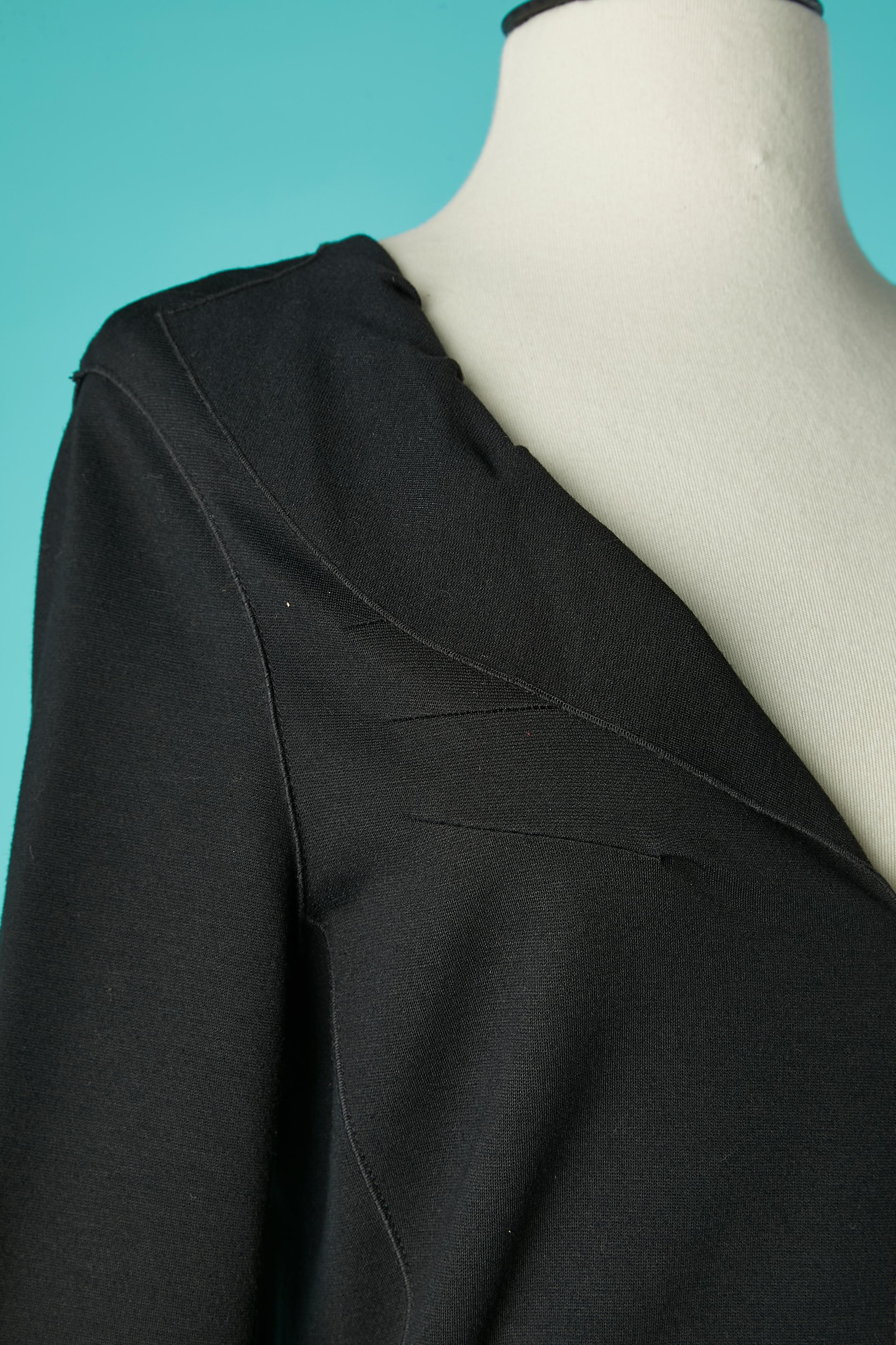 Black jersey dress with cut-work and top- stitching . Fabric composition: 72% rayon, 23% polyamide, 5% elasthane. 
Invisible zip on the left side. Top-stitched on the side of the bust
SIZE 38 / M 