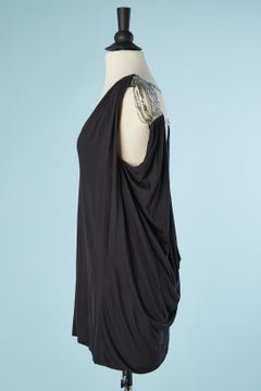 Black jersey sleeveless top with chainmail details on the shoulders Versace