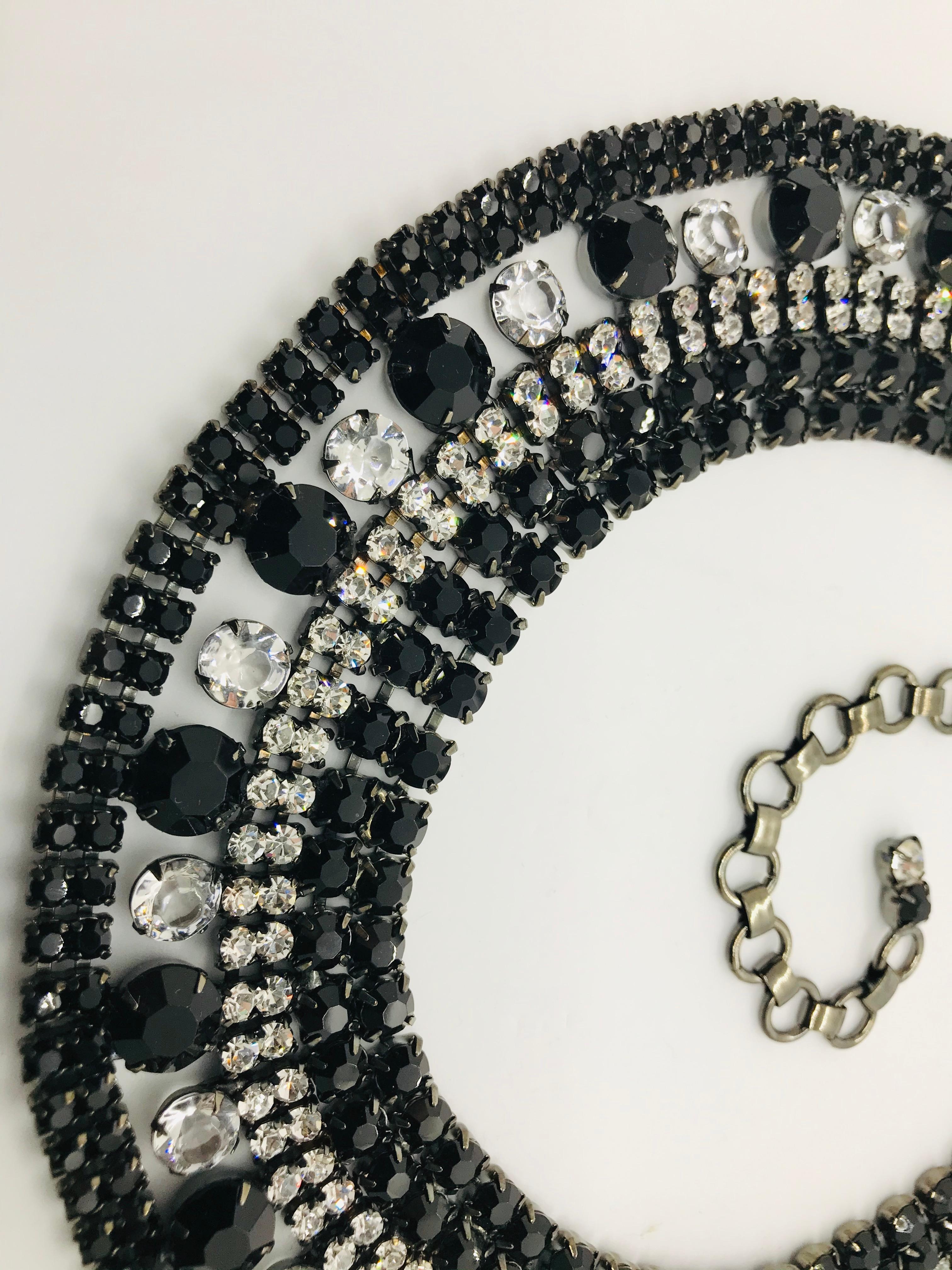 This black jet and clear Austrian crystal cleopatra collar necklace is a petite version of some of our larger cleopatra collar necklaces.  It is great for someone who may not be comfortable with larger necklaces.  It is an art deco inspired design