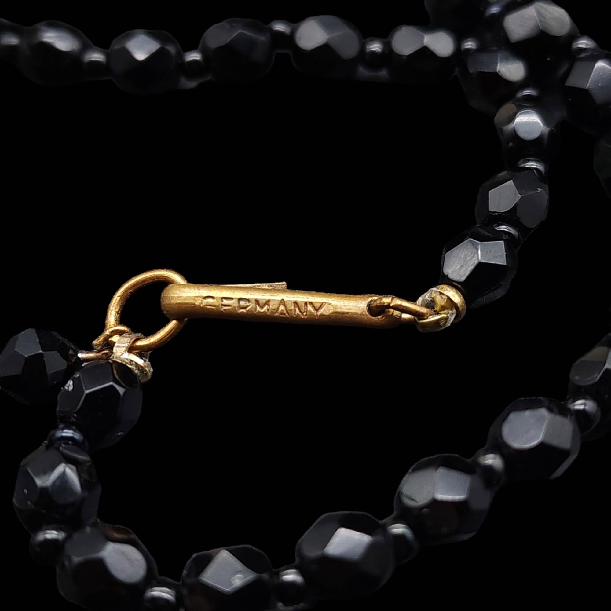 Women's or Men's Black Jet Faceted Graduated Bead Necklace West Germany Vintage, Brass Tone Clasp For Sale