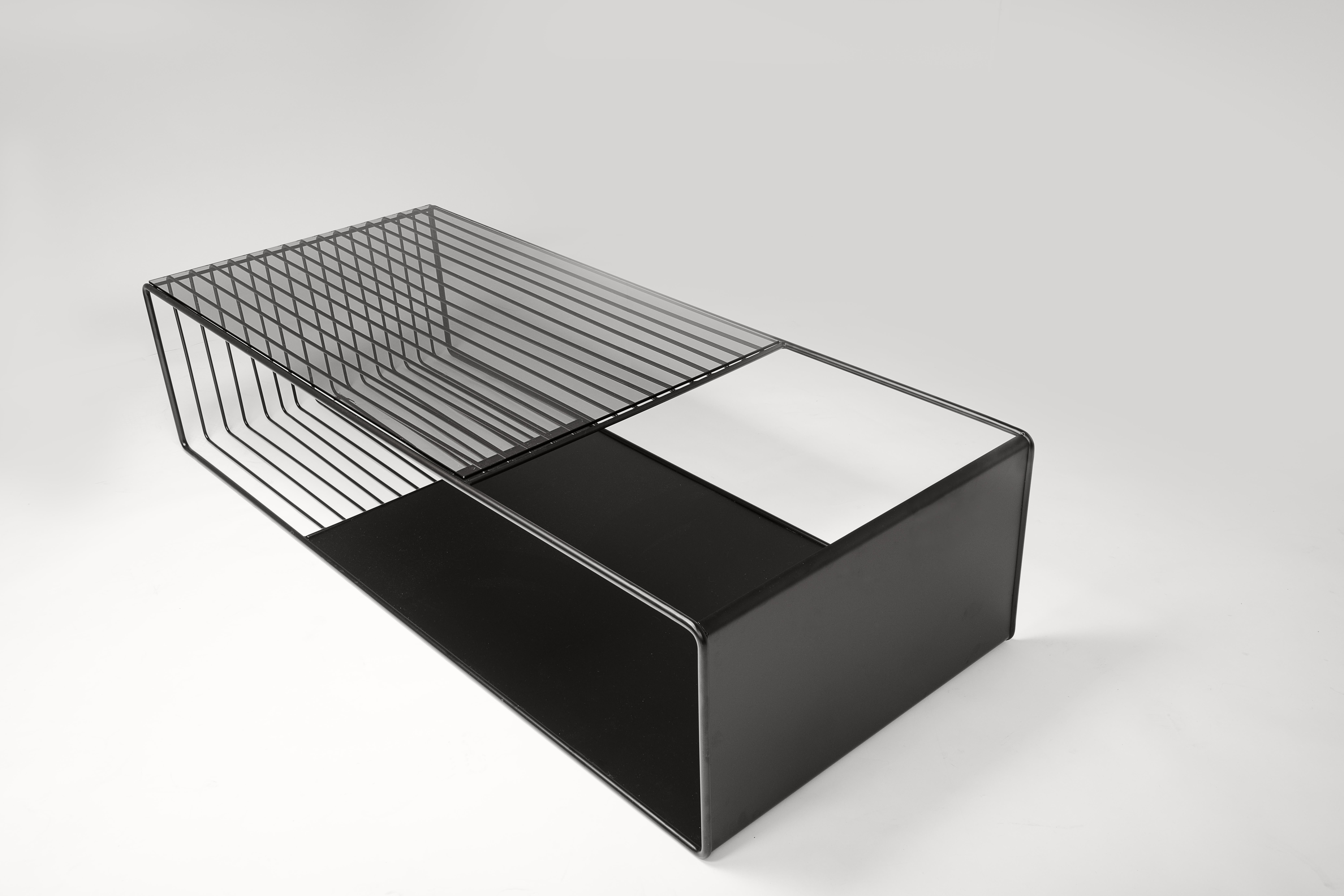 Black Kaleidoscope Low Coffee Table by Jialun Xiong
Dimensions: 60”W x 25”D x 14”H inch
Materials: Metal, Tempered tinted glass

Custom Size option available.

“ I have an aptitude for exploring the nuances of infinite combination of