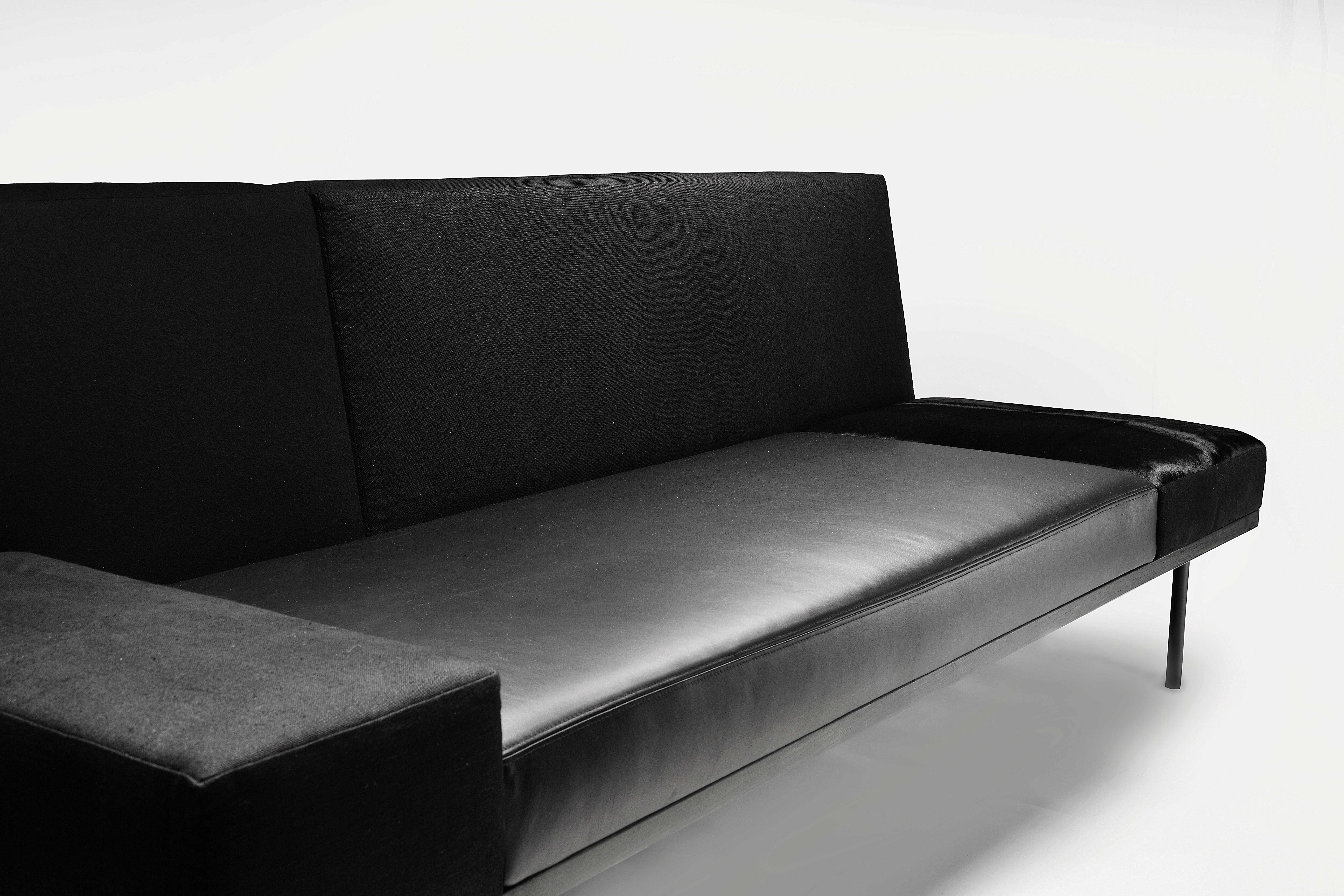 Black Kaleidoscope long sofa: An open composition seating unit over 6’ long is created by a combination of 7 different materials (metal, ashwood, linen, wool, leather, suede, and calf hide), a refined juxtaposition of proportion and