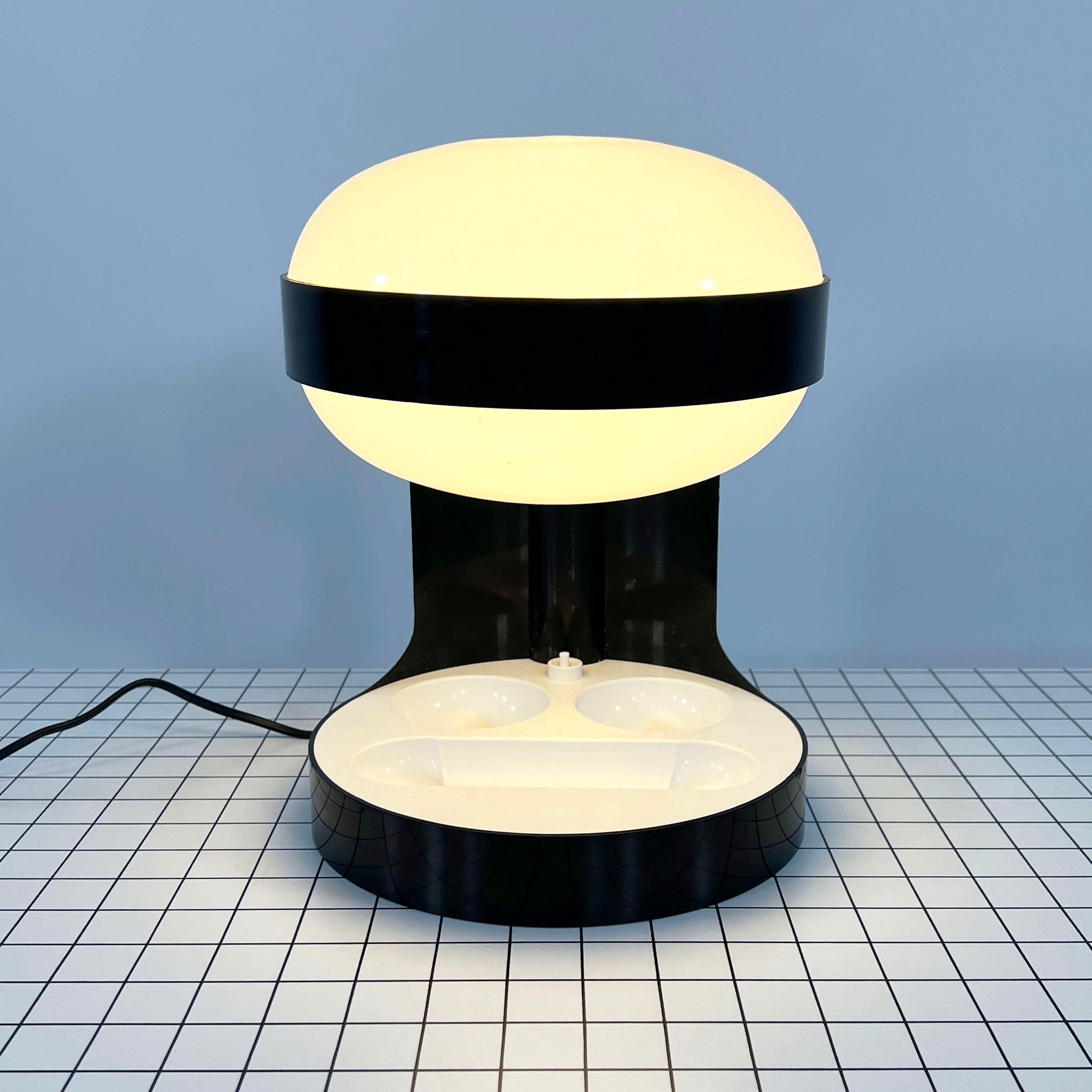 Designer - Joe Colombo
Producer - Kartell
Model - KD 29
Design Period - Seventies
Measurements - Width 25 cm x Depth 25 cm x Height 34 cm
Materials - Plastic
Color - Black, White
Electrical Properties - European Plug (up to 240V) / Lightbulb