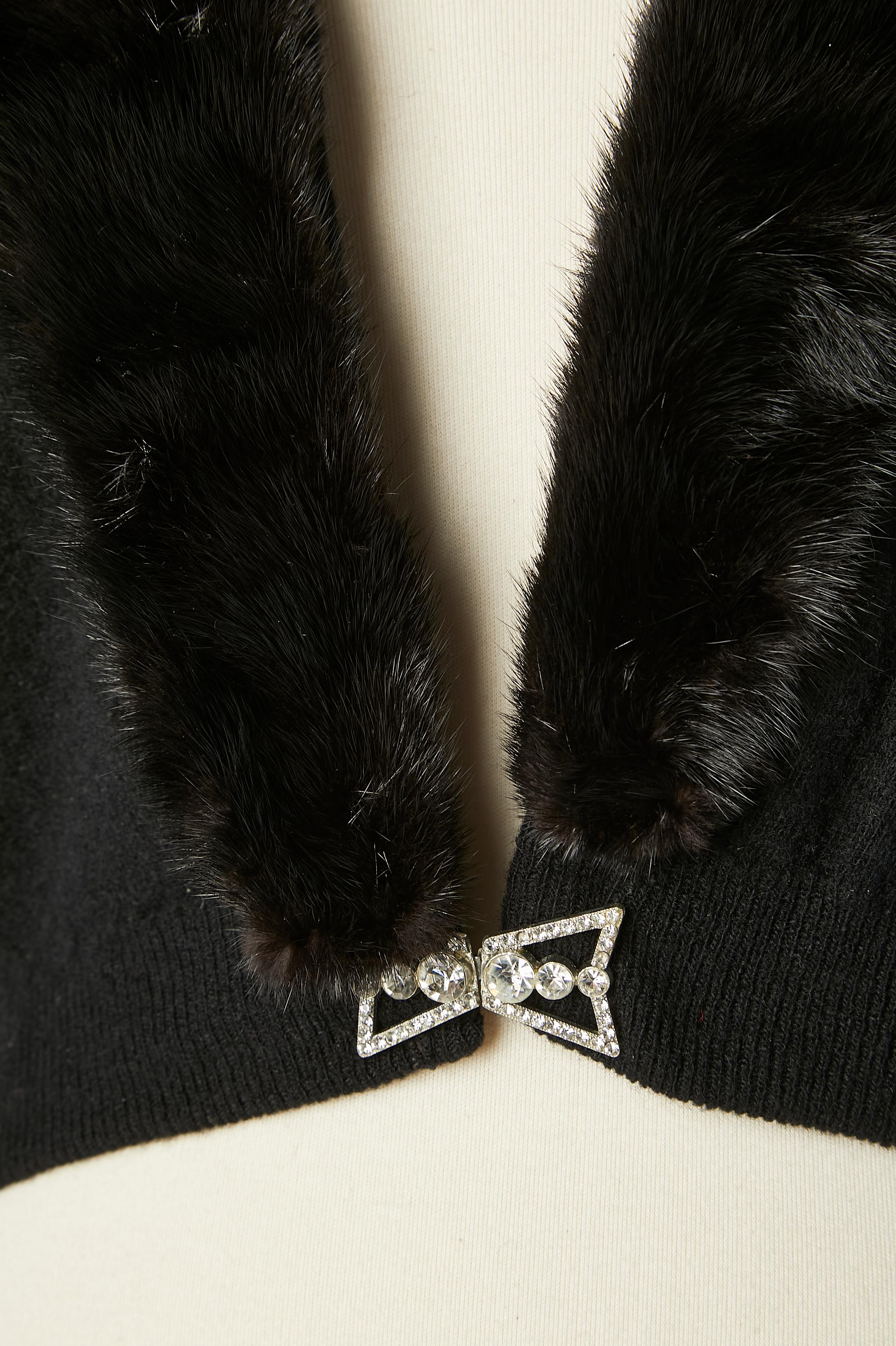 Black knit cardigan with detachable fur collar and lace lining. Hook&eye closure on the middle front. Detachable mink collar with snap. Rhinestone buckle closure on the middle front on the waist 
SIZE S/M 