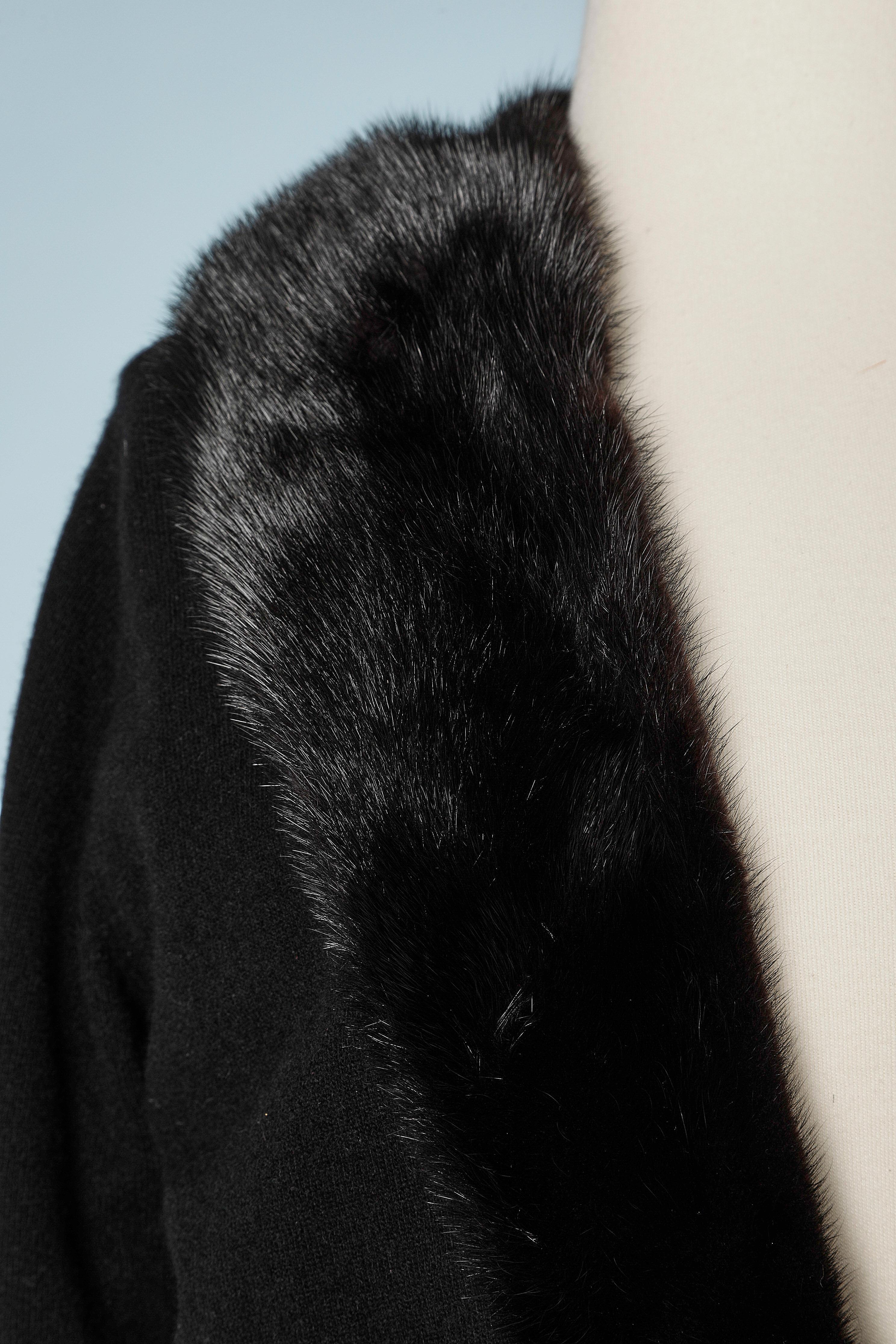 Black knit cardigan with mink collar. Lace lining. One hook&eye on the middle front on the waist + buckle made of metal, pearls and rhinestone. 
SIZE S 