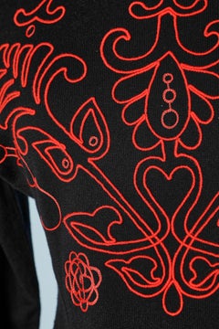Black knit dress with red passementerie application Giani Versace