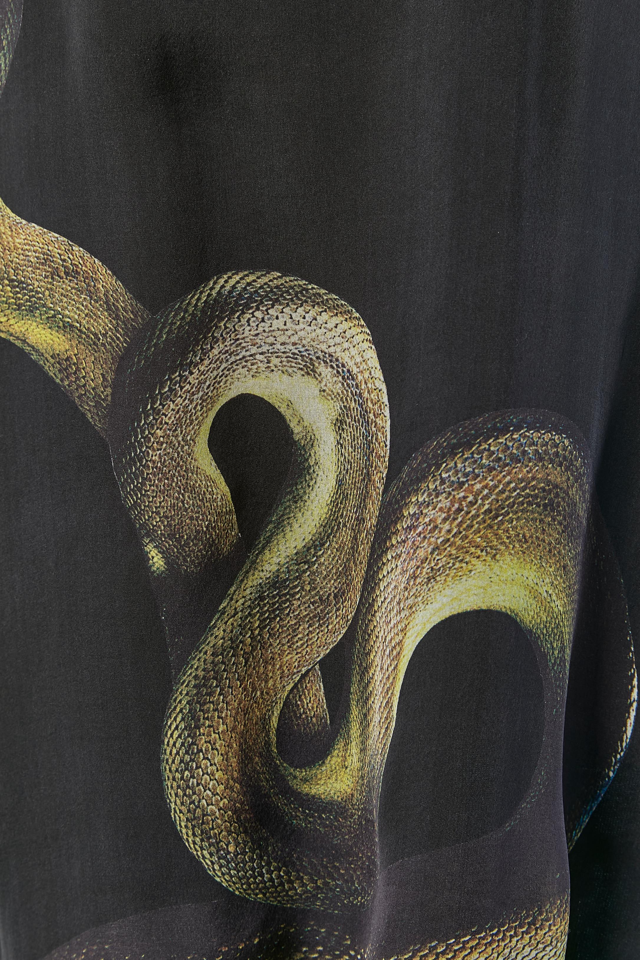 Black knit dress with silk double lay on the front with snake print. Knit composition: 82% cotton, 18% nylon. 
SIZE L 