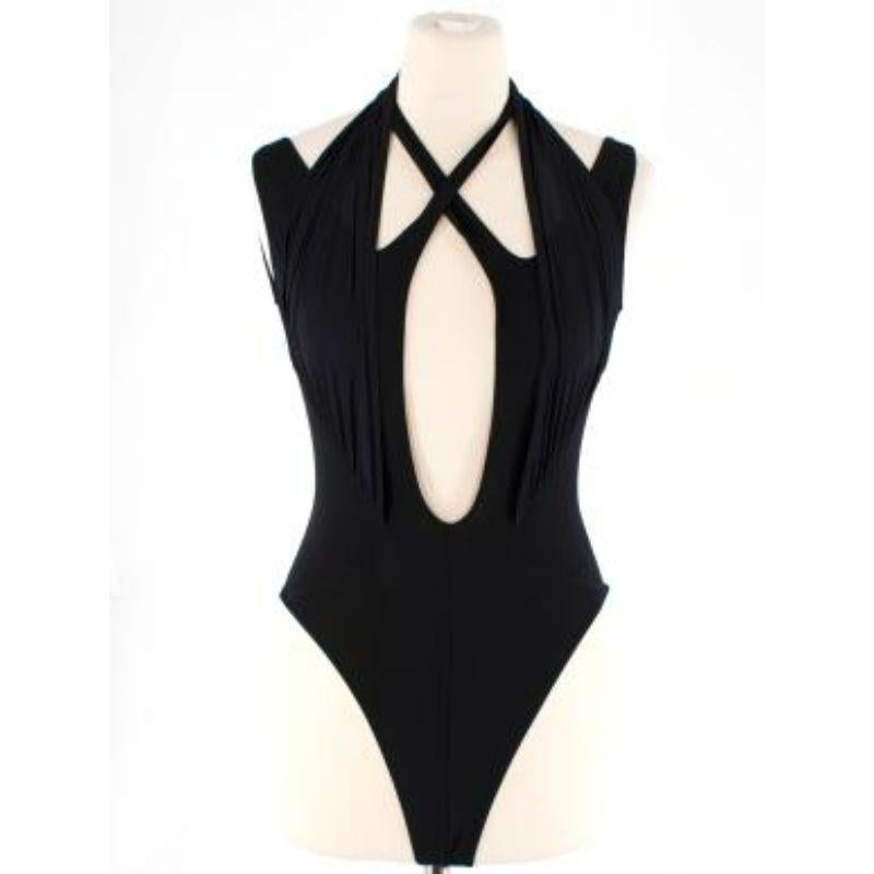 Mugler Black Knit Low Scoop Bodysuit
 
 
 
 - Soft cotton body
 
 - Sheer panel straps 
 
 - Cross over cotton straps 
 
 - Scoop back 
 
 - High leg 
 
 - Crotch popper fastening 
 
 
 
 Materials:
 
 Main:
 
 100% Viscose
 
 Other:
 
 77%