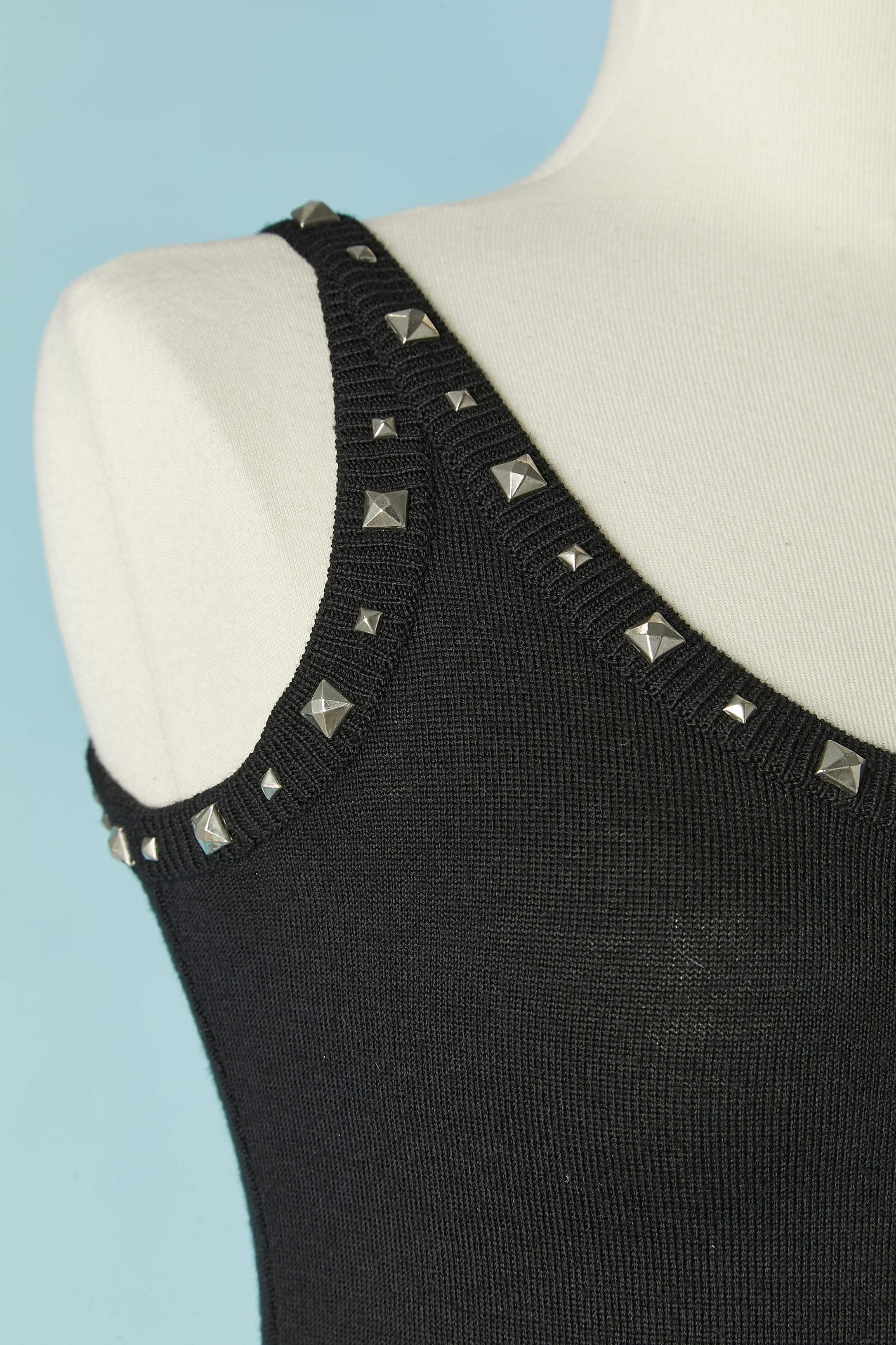 Black wool knit tank-top and wool trouser with studs embellishment. 
Size of the top: 38 (Fr) M 
Size of the trouser: 34 (Fr) XS