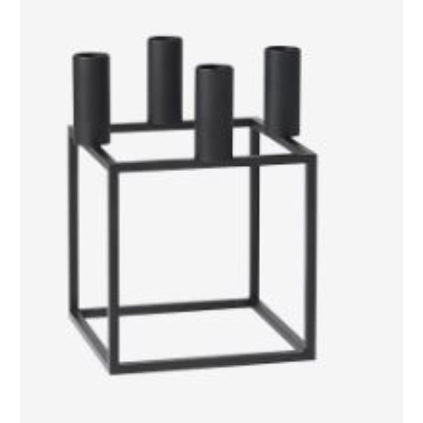 Black Kubus 4 candle holder by Lassen
Dimensions: D 14 x W 14 x H 20 cm 
Materials: Metal 
Also available in different dimensions.
Weight: 1.50 Kg

A new small wonder has seen the light of day. Kubus Micro is a stylish, smaller version of the