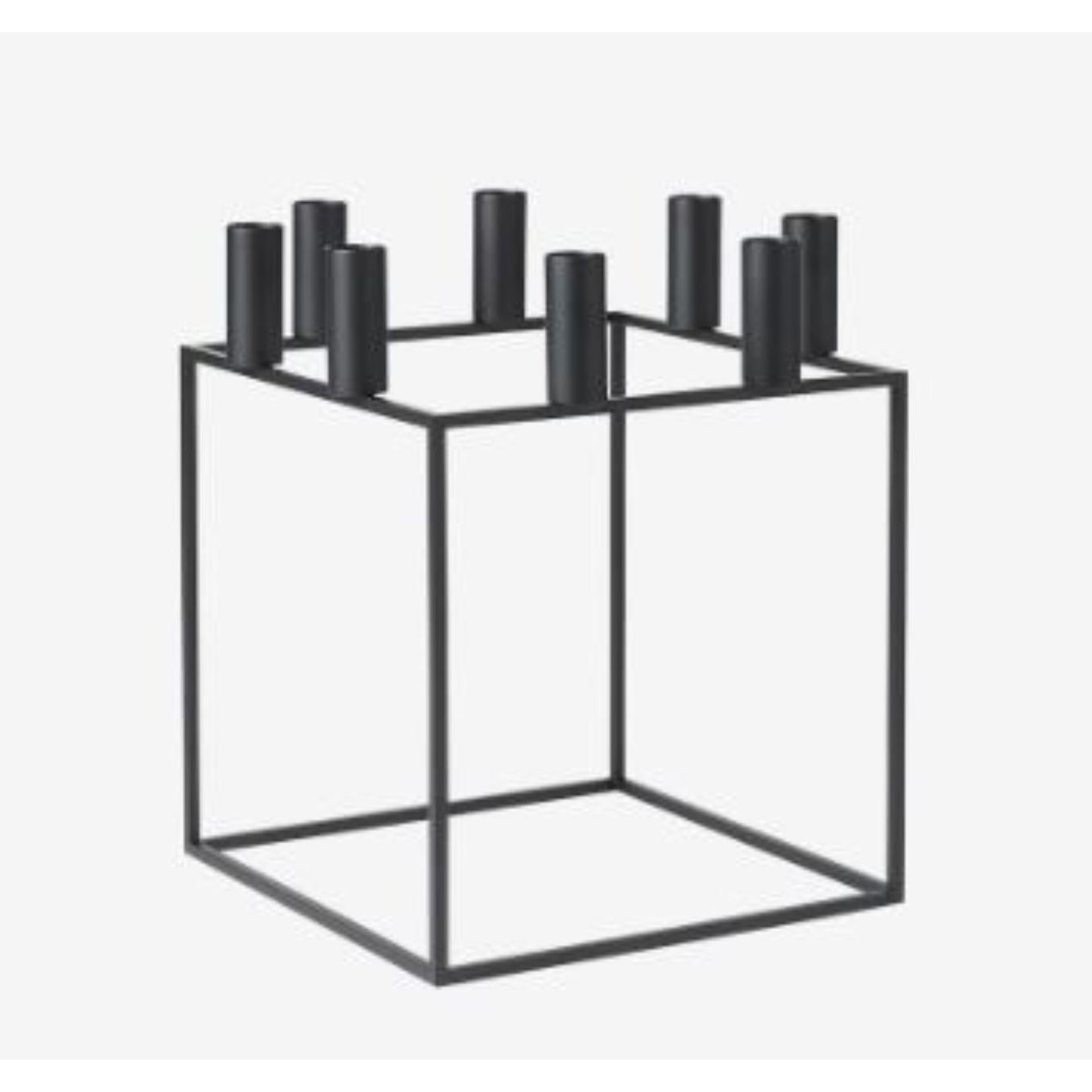 Black Kubus 8 candle holder by Lassen
Dimensions: D 23 x W 23 x H 29 cm 
Materials: Metal 
Also available in different dimensions. 
Weight: 1.50 Kg

With a sharp sense of contemporary Functionalist style, Mogens Lassen designed the iconic
