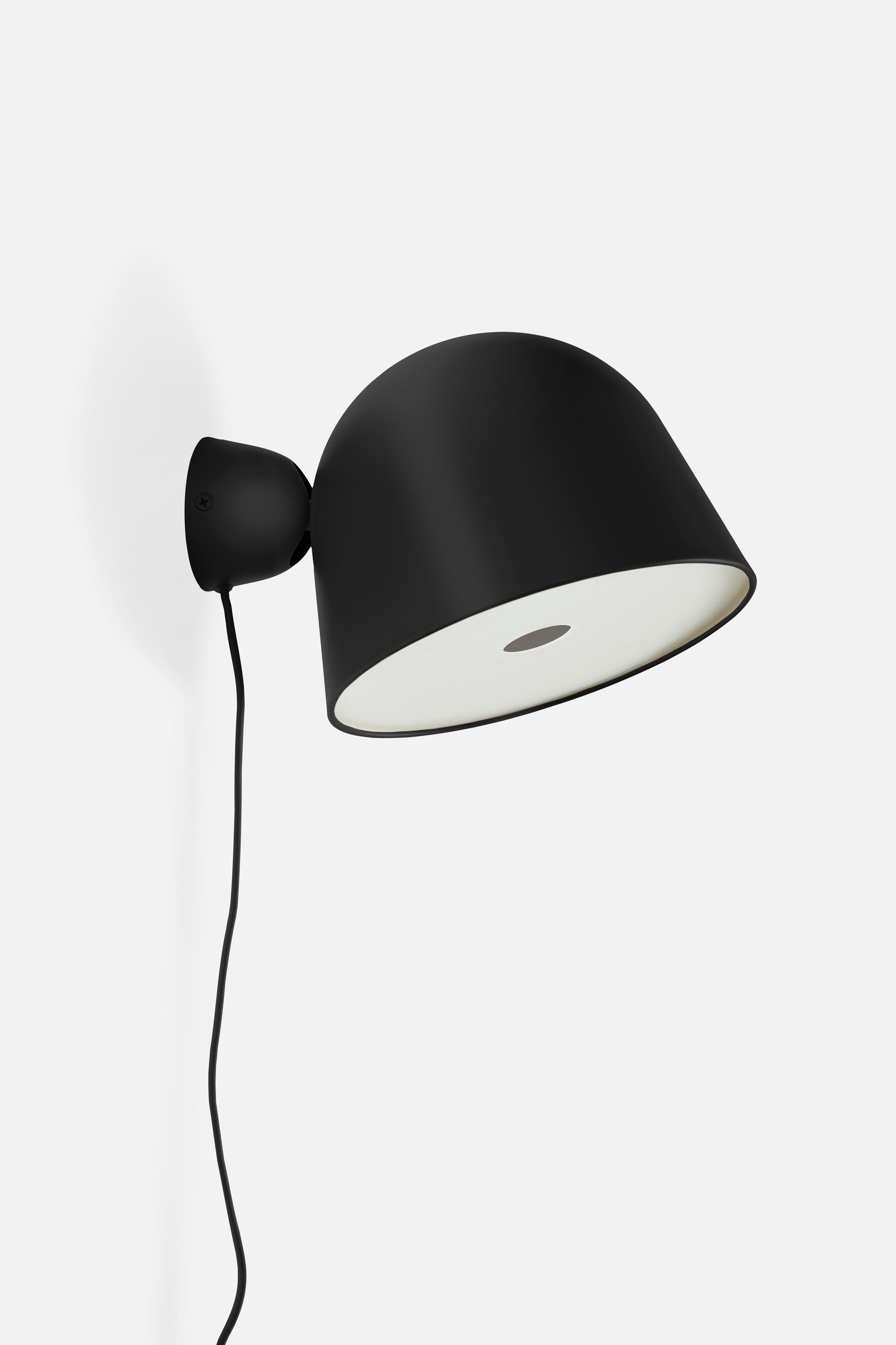Black Kuppi wall lamp by Mika Tolvanen.
Materials: metal.
Dimensions: D 24 x H 16.5 cm.
Available in black or mustard yellow.

Mika Tolvanen is a renowned Finnish designer. After graduating from The Royal College
of Art, London, he established
