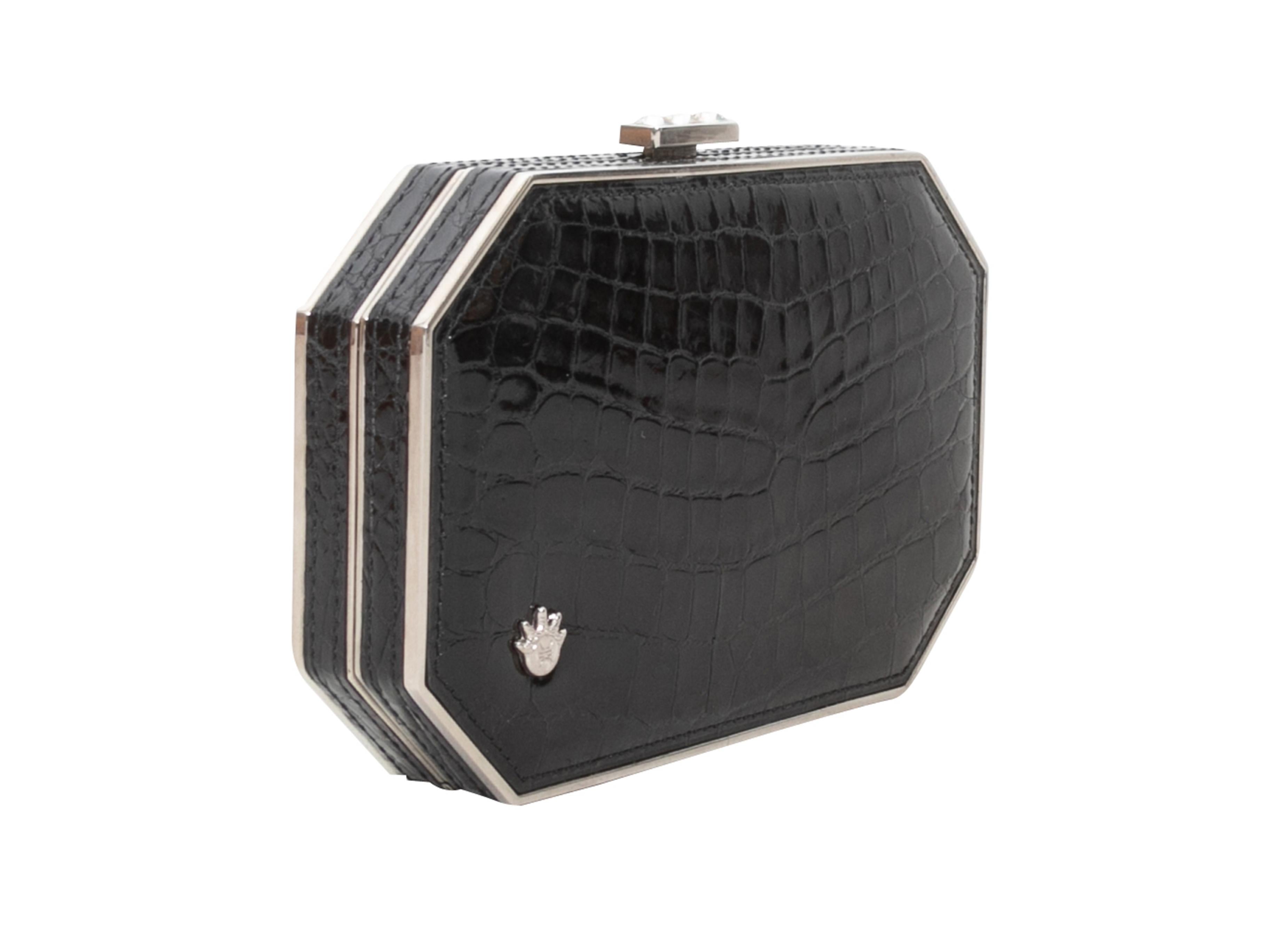 Product Details: Black Kwanpen Crocodile Frame Clutch. This clutch features a crocodile skin body, silver-tone hardware, an optional chain-link top handle, and a top clasp closure. 6