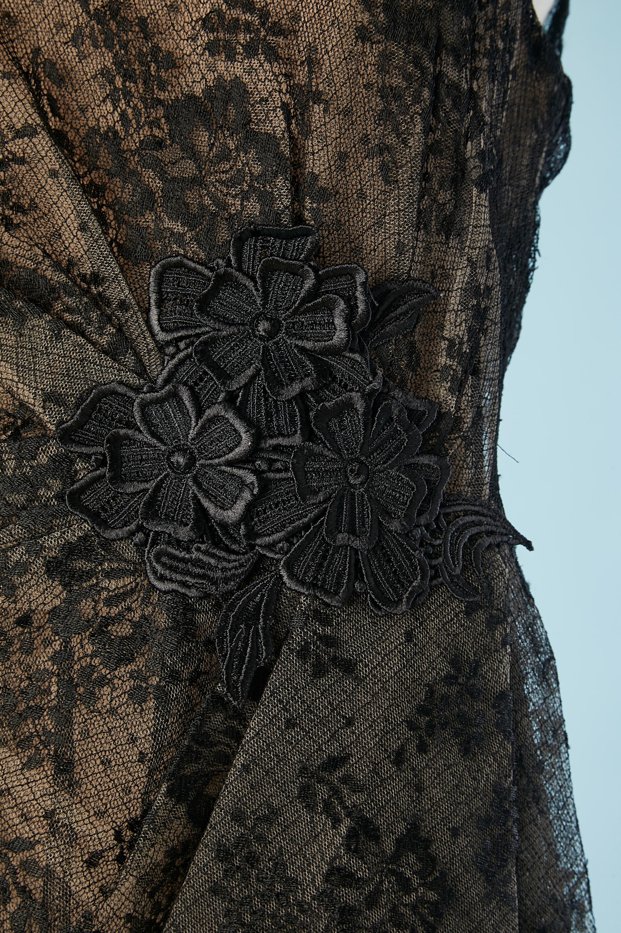 Black lace cocktail dress with nude color silk lining and black passementerie flower embroidery. Zip in the middle back and hook&eye. ( no more fabric composition tag) 
SIZE 10 