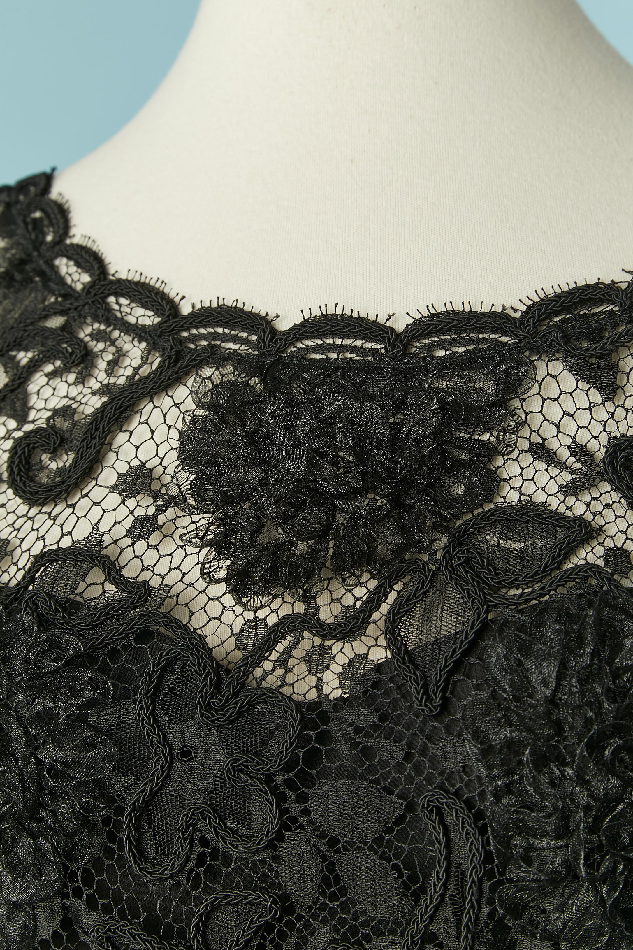 Black lace top with silk boned bustier underneath. Lace composition: 85% rayon, 15% nylon. Bustier composition: 92% silk 8% spandex. 
Padded bra. Zip closure on the middle back for the bustier and gros-grain waist-band with hook&eye closure. 
Snap
