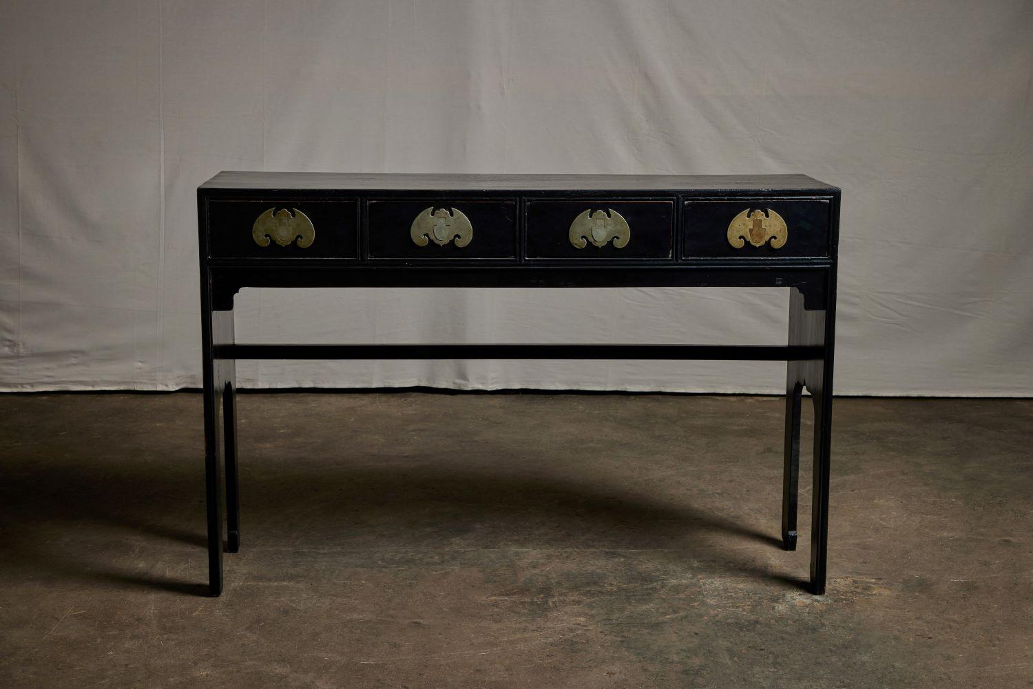 Black Lacquer 4 Drawer side table with white brass bat hardware.