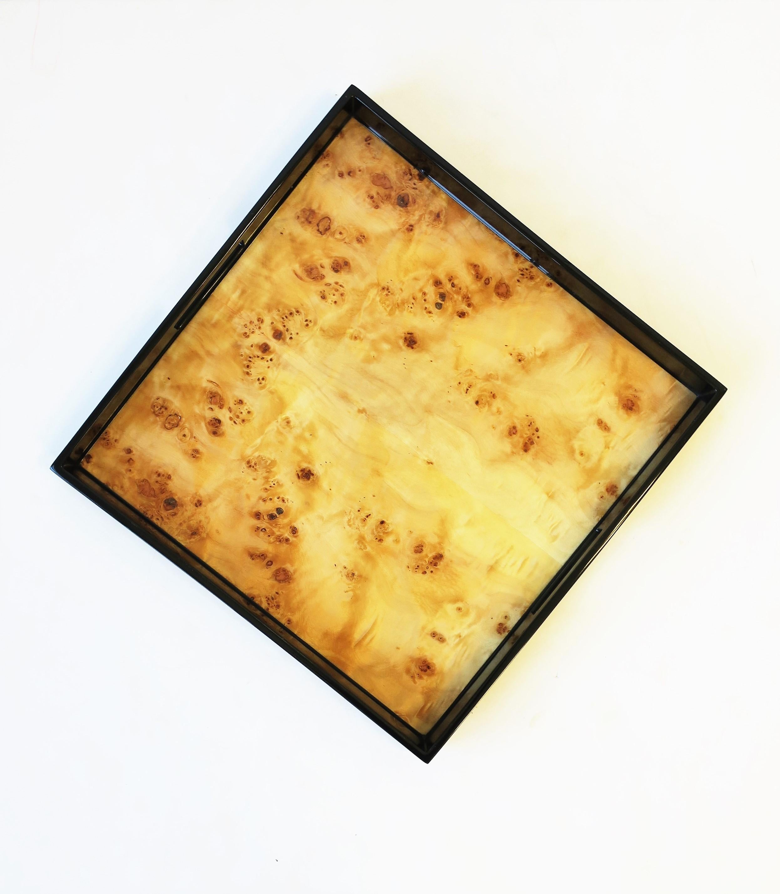 A black lacquer and blonde burl wood serving tray, square, with handles. A great piece for serving or for display. Dimensions: 2