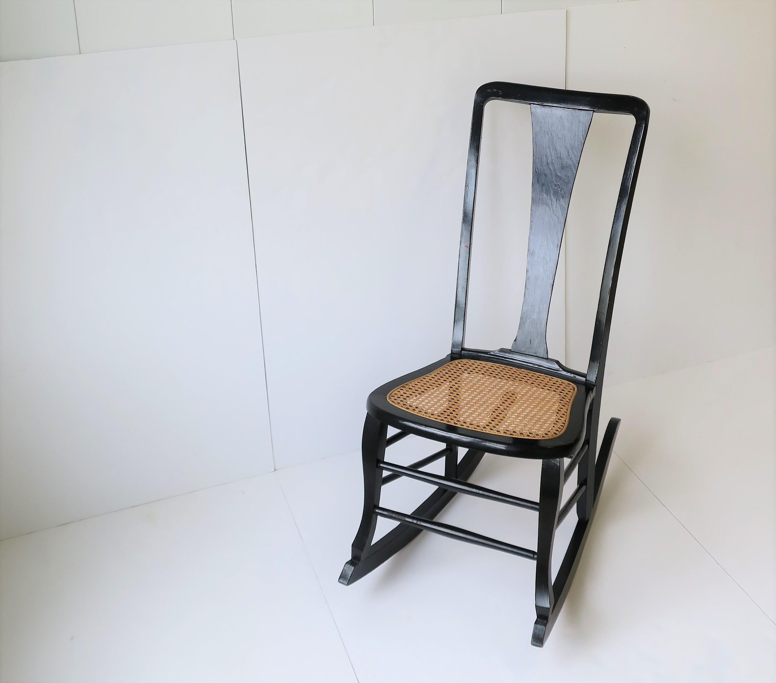 Wicker Cane and Black Wood Rocking Chair In Good Condition For Sale In New York, NY