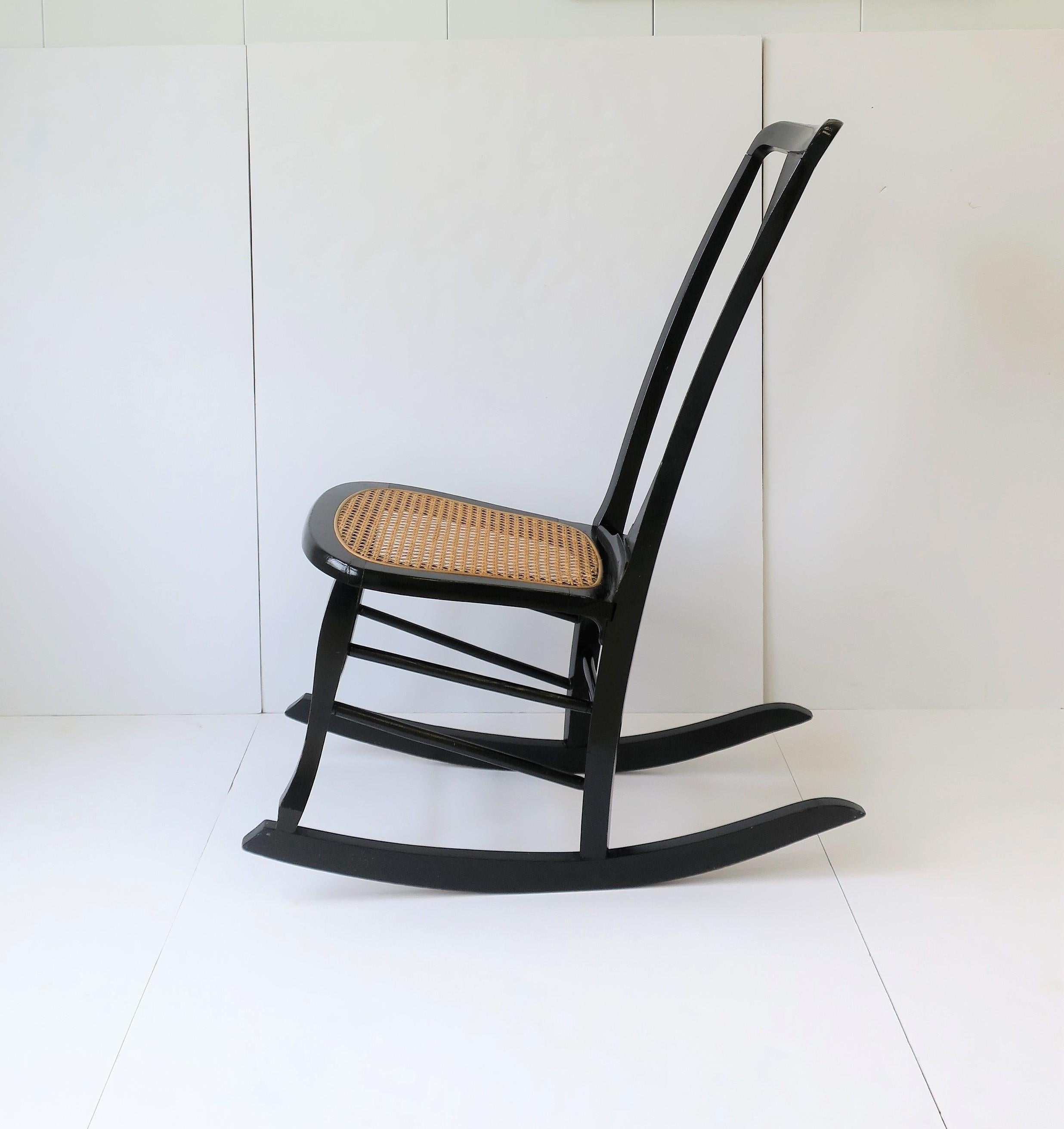 Painted Wicker Cane and Black Wood Rocking Chair For Sale