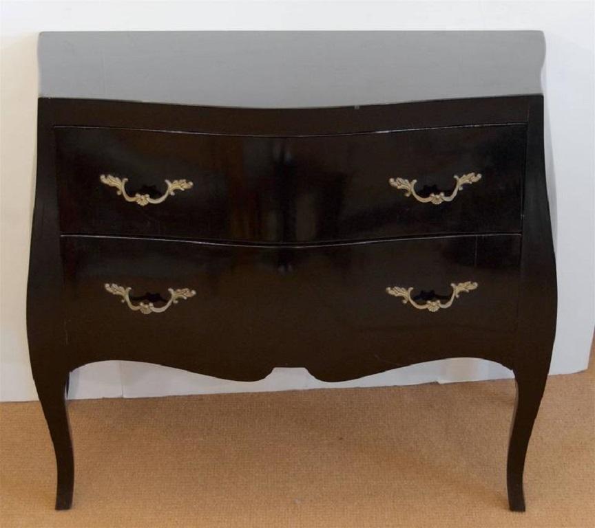 Beautiful black lacquered bombe chest with brass pulls. Interiors lined with fleur-de-lis paper.
