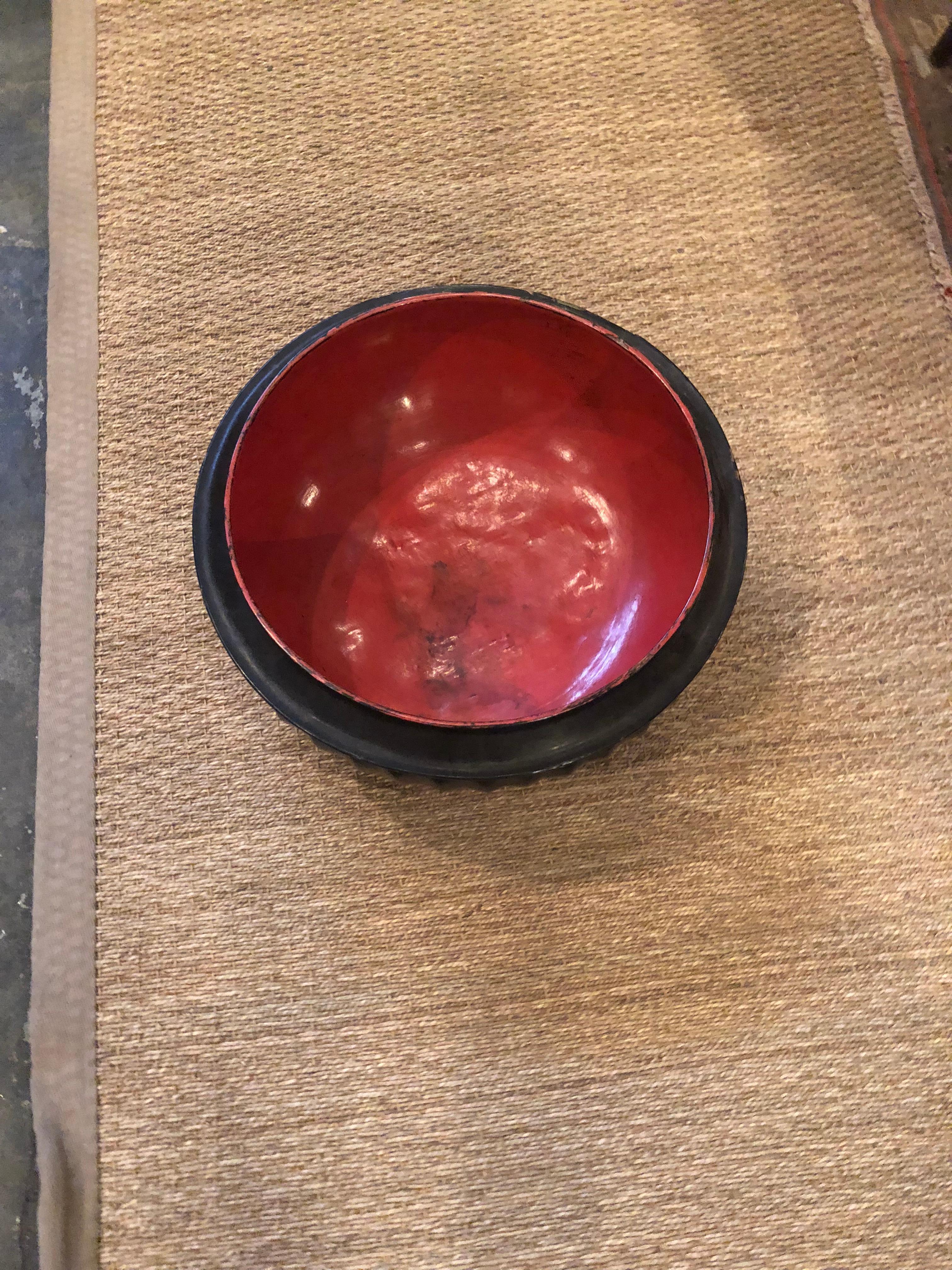 Black lacquer bowl with red inside.
