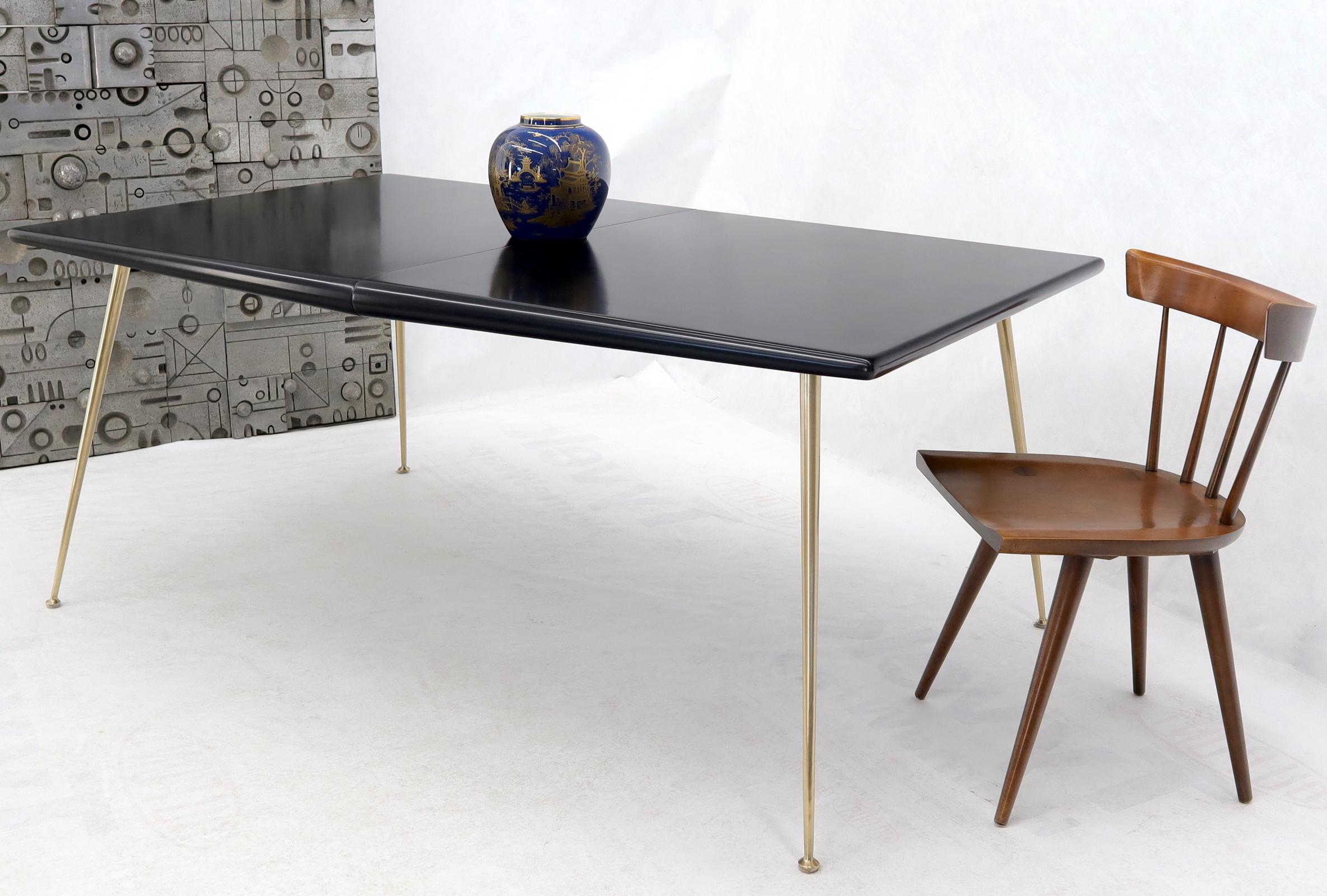 Mid-Century Modern black lacquer top brass legs dining table by Robsjohn-Gibbings. Comes with 1 x 18