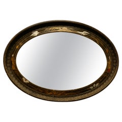 Antique Black Lacquer Carved Chinoiserie Oval Wall Mirror