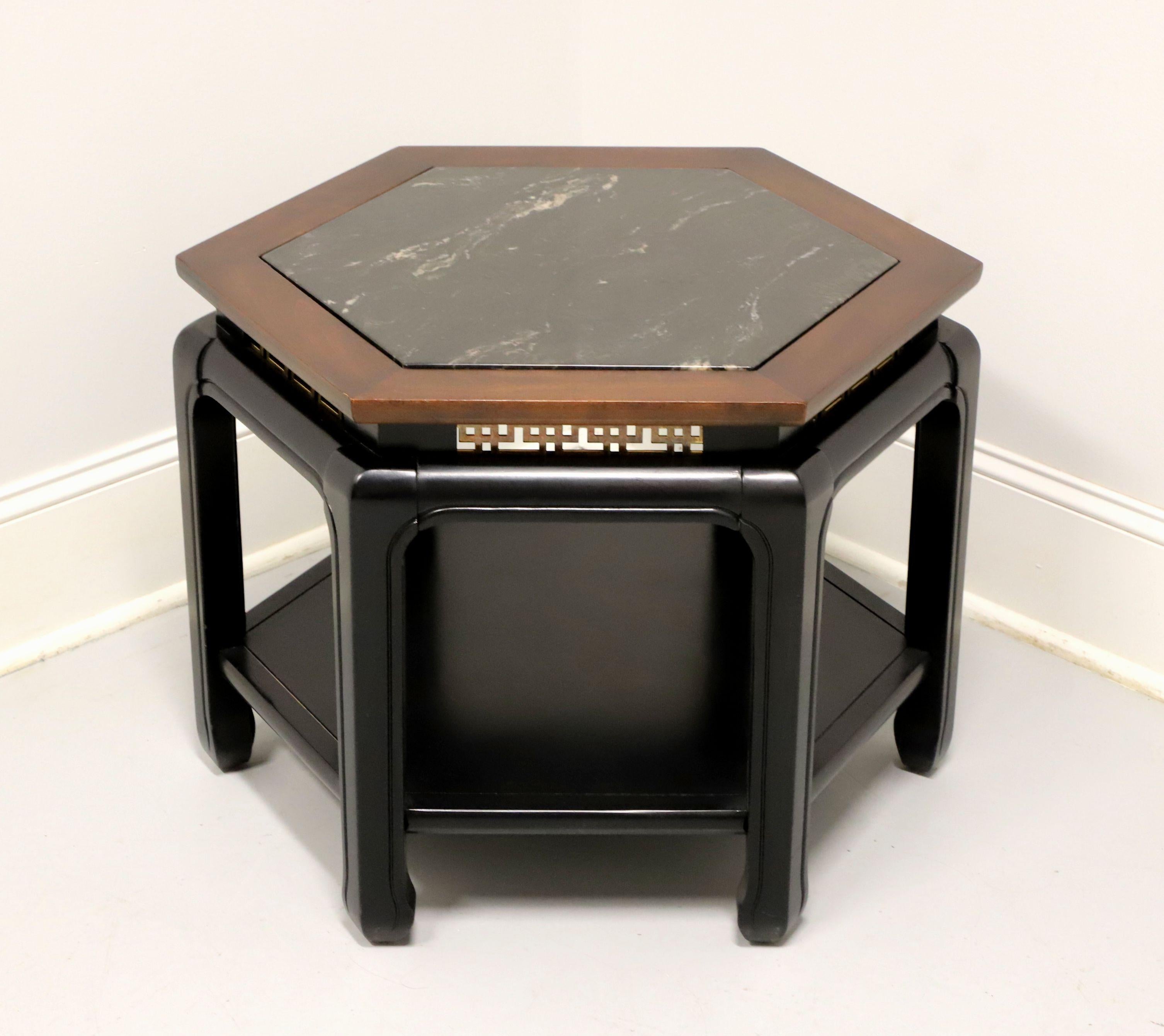 An Asian Chinoiserie style side table, unbranded, similar quality to Century or Henredon. Cherry painted with black lacquer, hexagon shaped cherry banded & inset marble top, brass in a Chinoiserie design to apron, a lower tier shelf and six slightly
