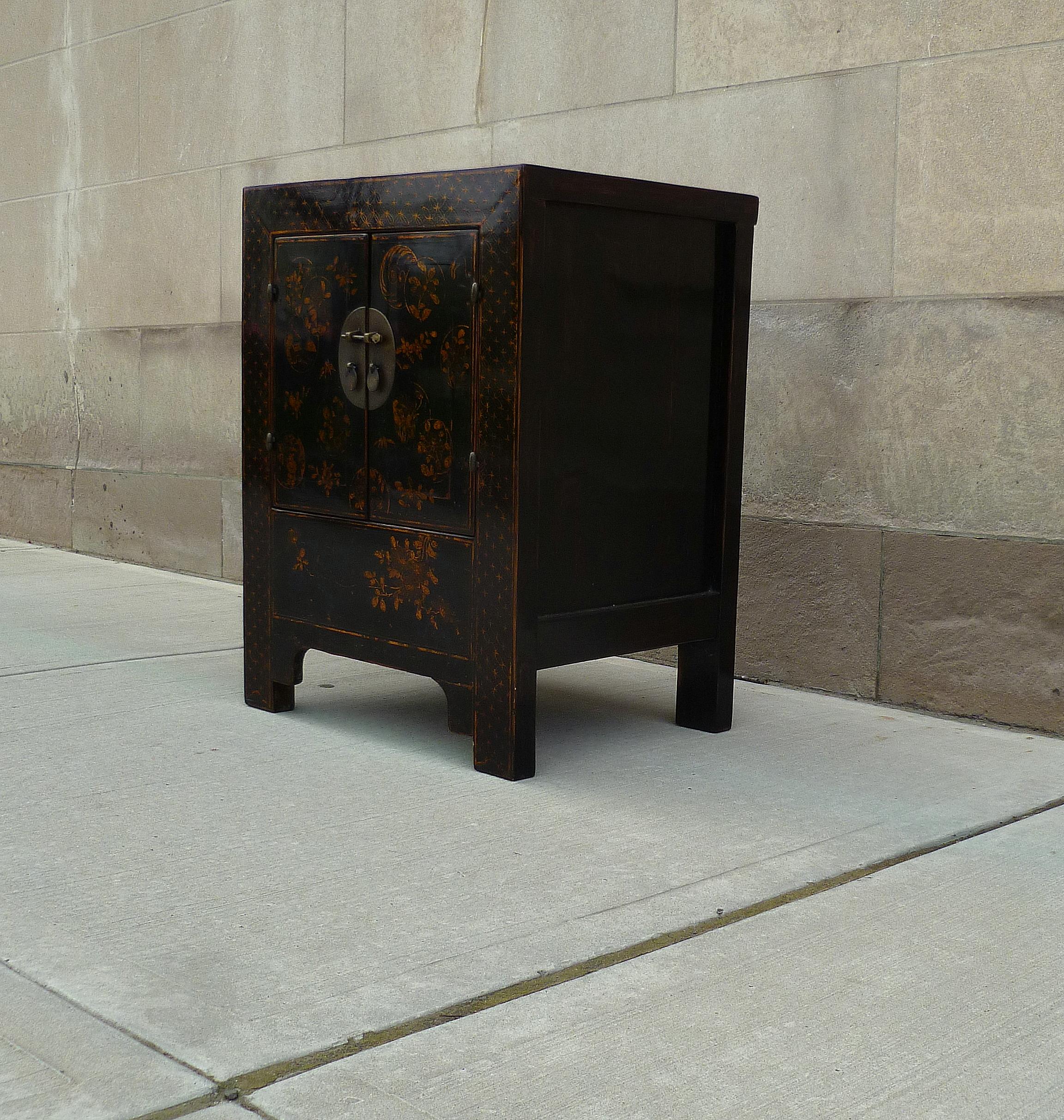 Polished Black Lacquer Chest with Gilt Motif For Sale