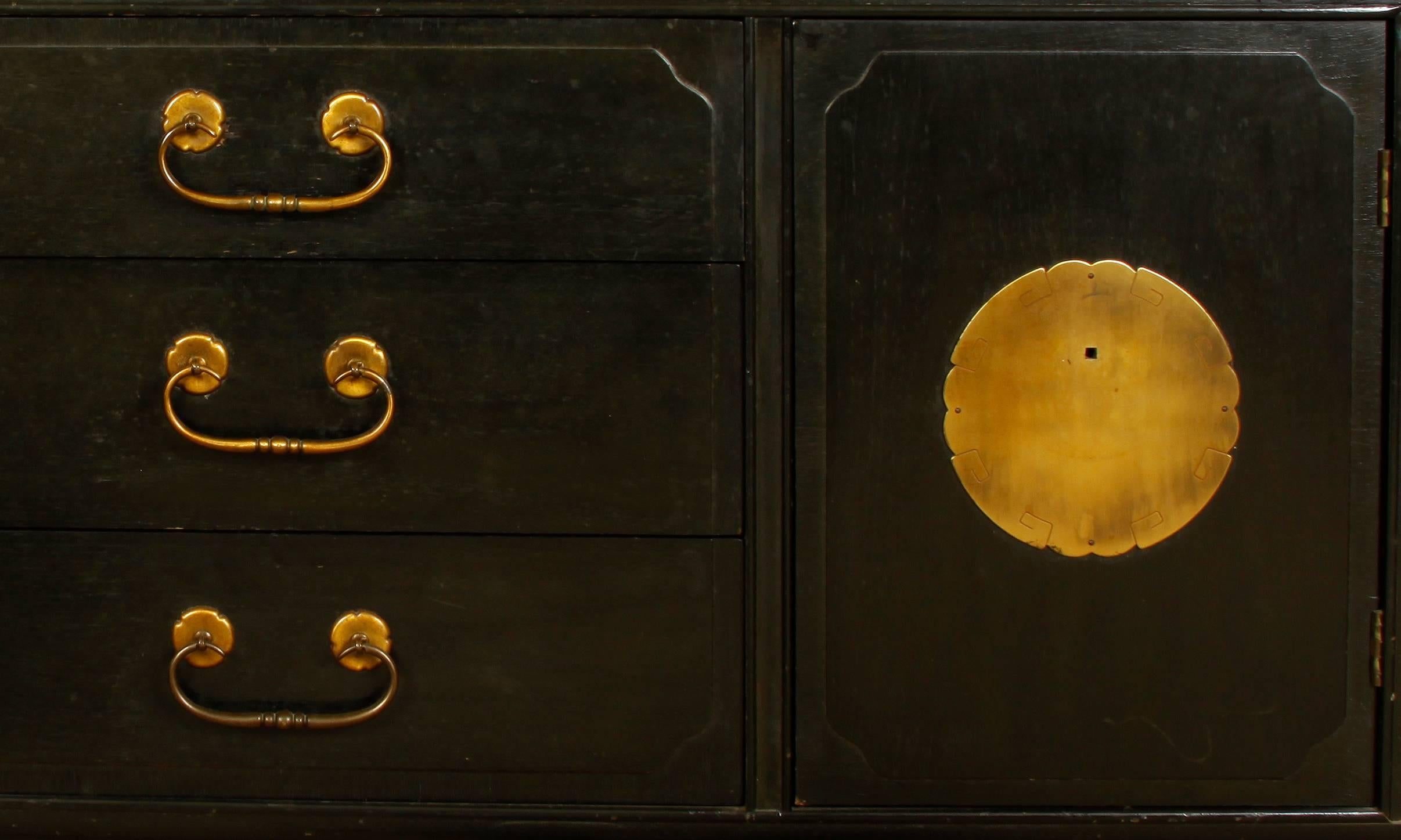 Black lacquer chinoiserie breakfront cabinet with brass hardware.