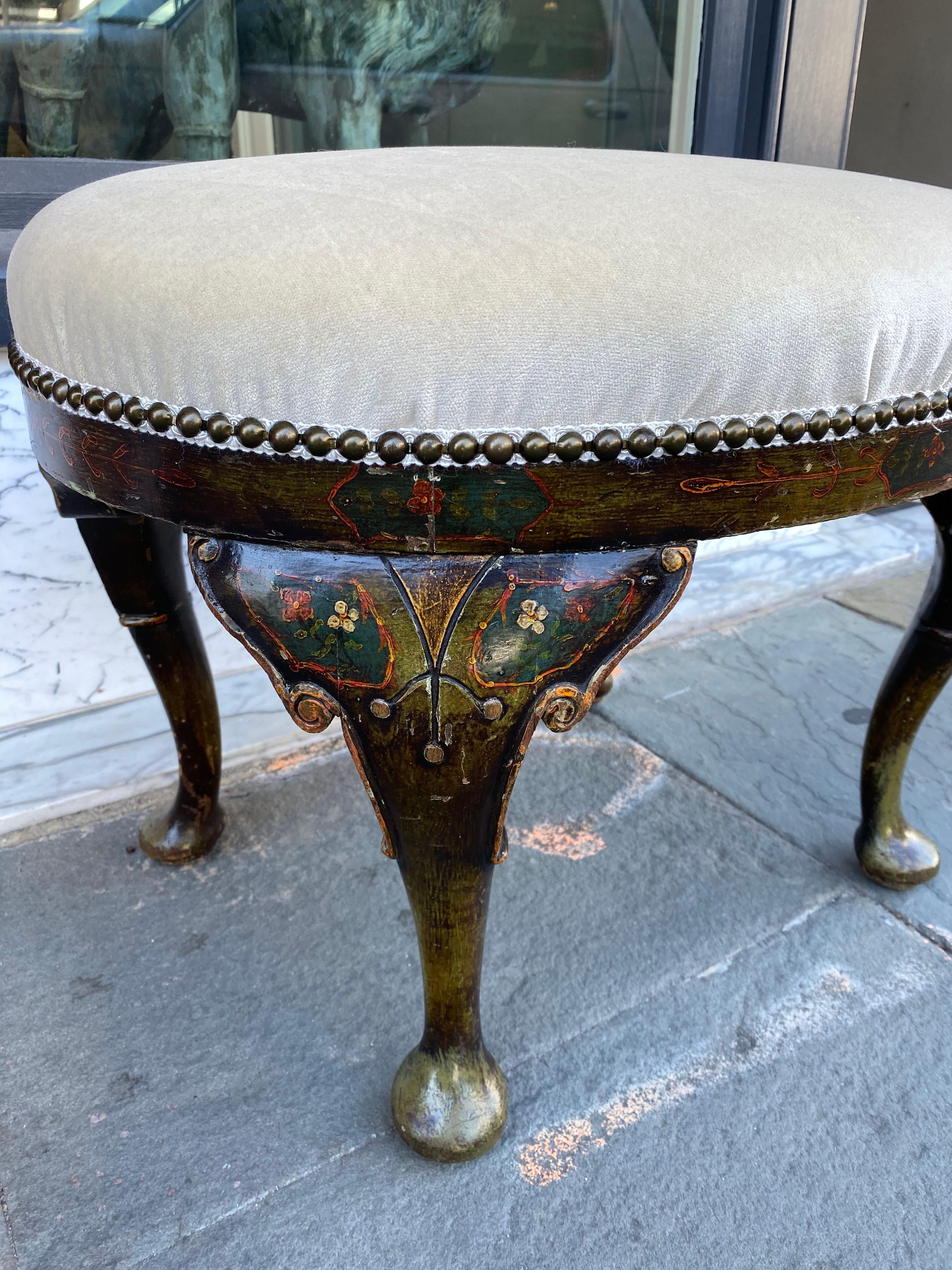 Black lacquer chinoiserie pad foot, oval footstool.