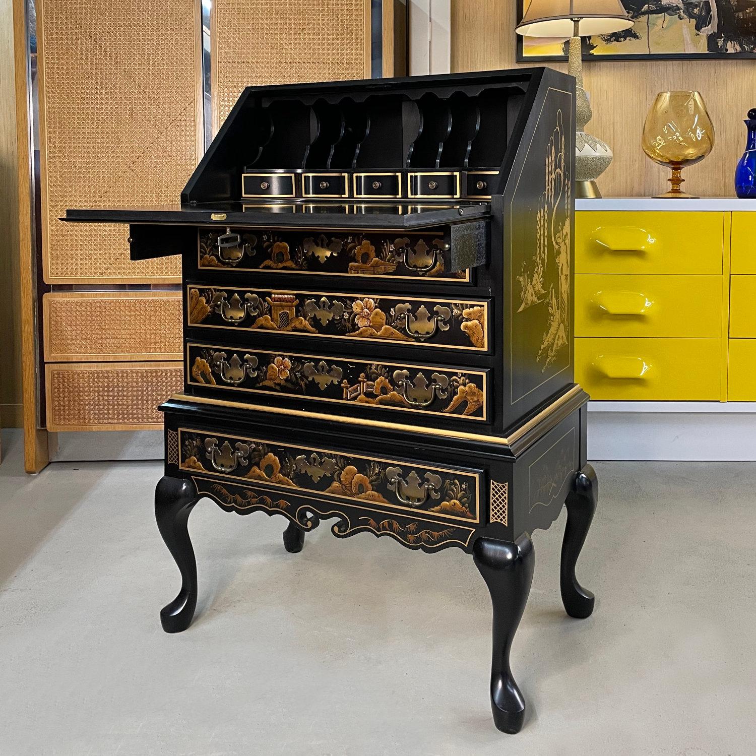 This incomparable slant-front chinoiserie black lacquer secretary desk depicts a serene, traditional Asian motif from head to toe.  The gold and greens appear as mystical and radiant as the subject itself.  

This desk is a magical treasure chest of