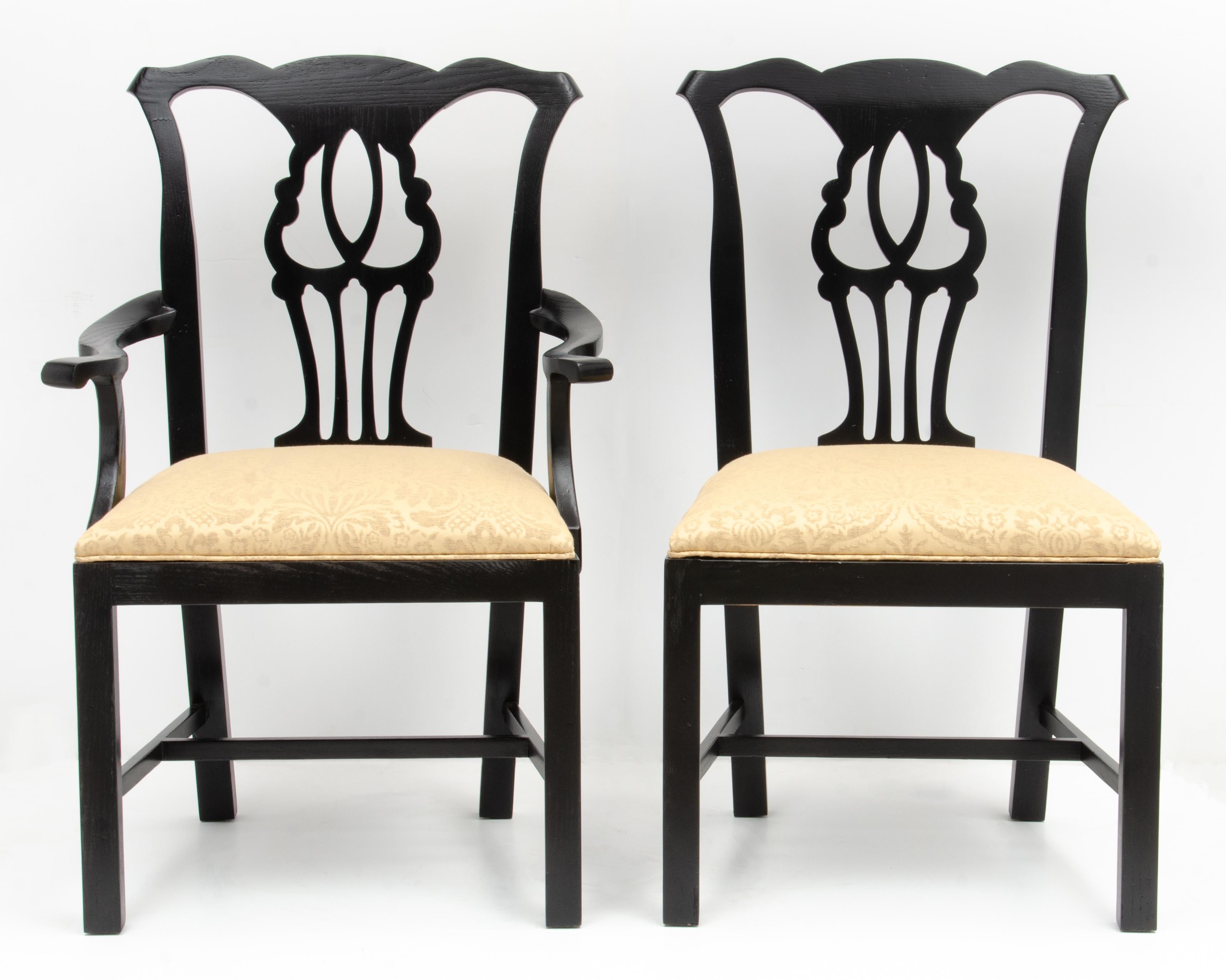 A set of six John Stuart Chippendale dining chairs, two captains chairs and four side. The design of the chairs is very modern, with flat fronts. The black lacquer finish accentuates the modern feel of the chairs and it is easy to see how chairs
