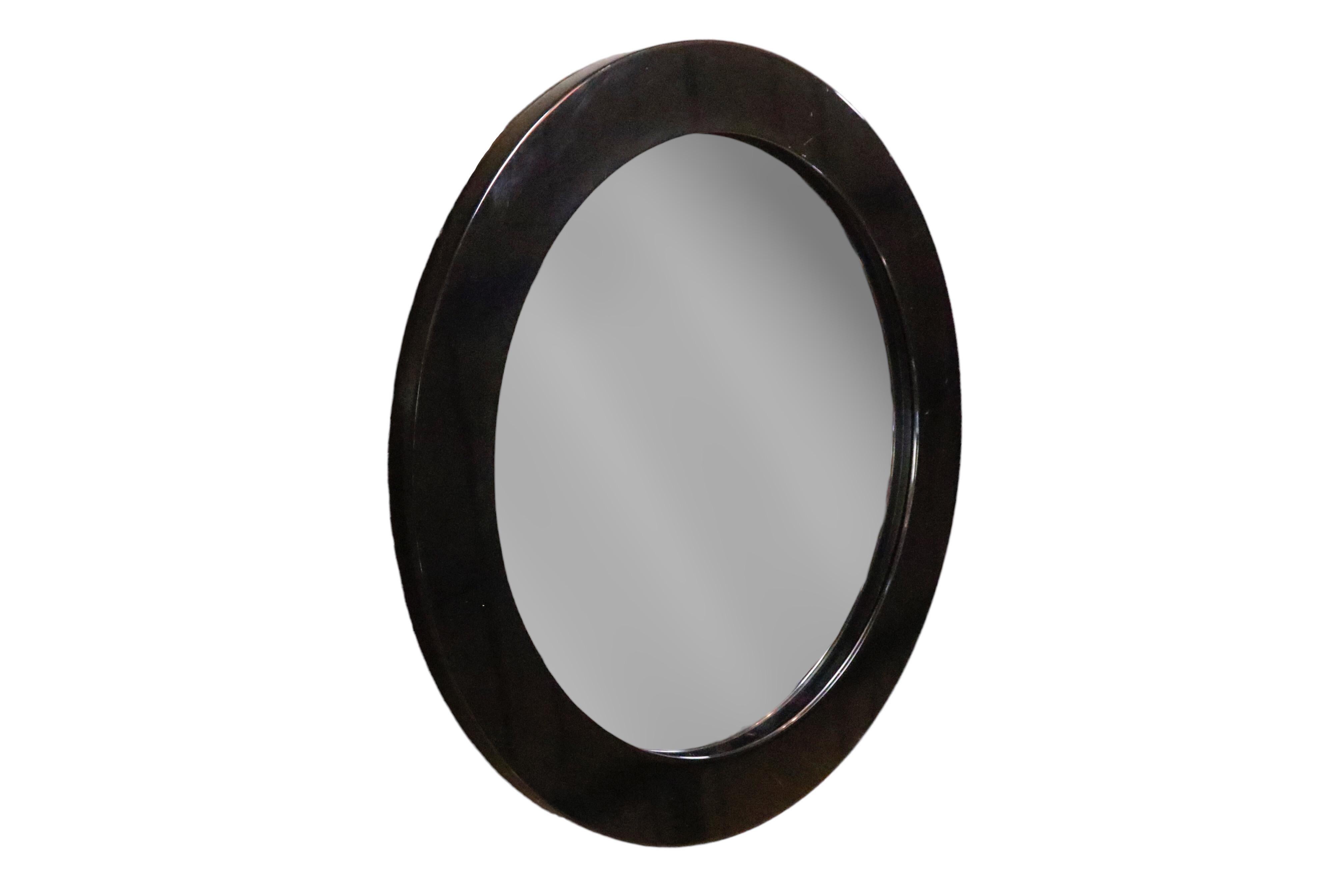 A custom made round wall mirror with a thick, deep substantial frame.  USA, circa 2000.

Frame is constructed of solid wood with a black lacquer finish.

Measures 36 inches wide with a 1.75 inch deep frame. 
