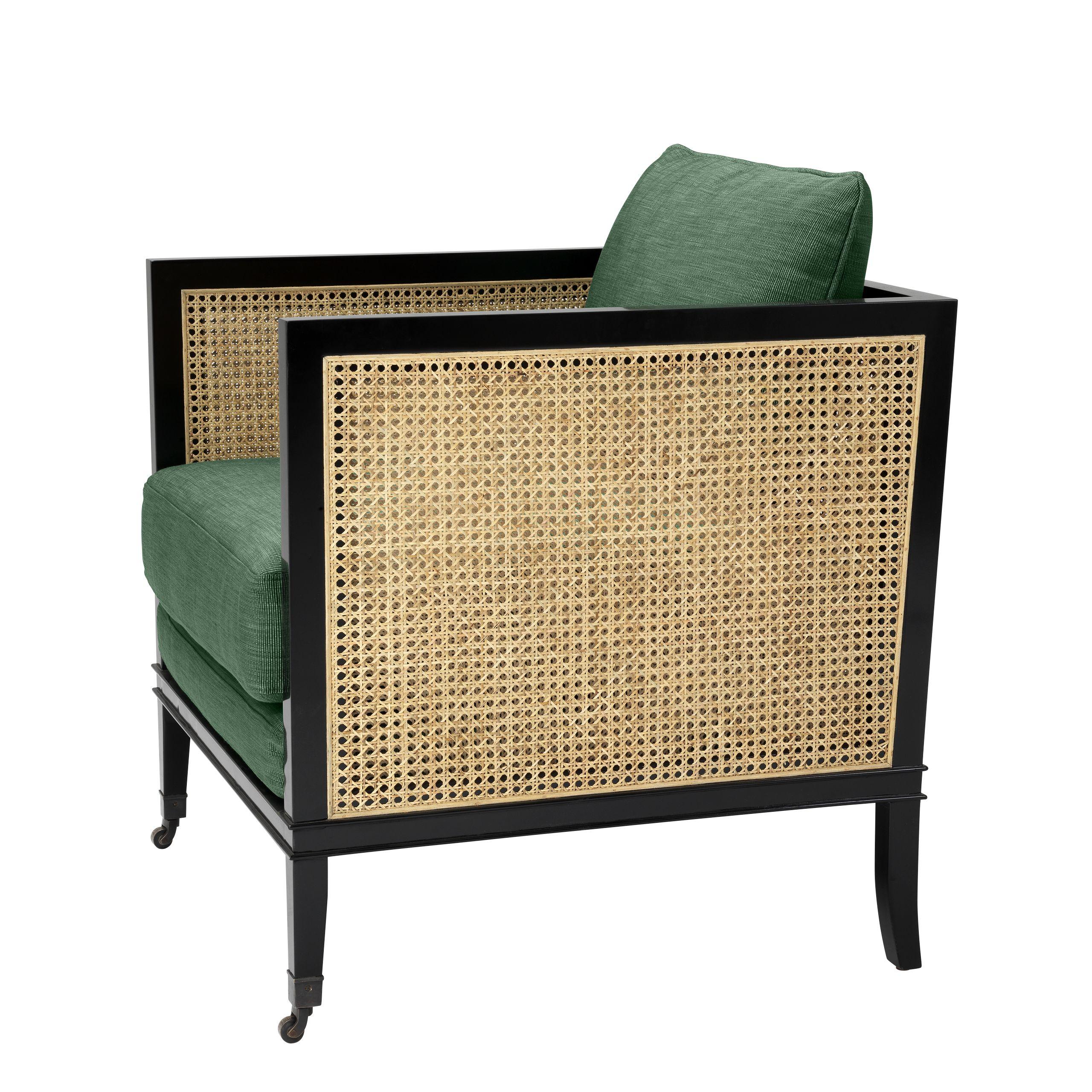 Black lacquer wooden structure brass wheels finish adorned with woven cane panels and green fabric Art Deco style lounge armchair.