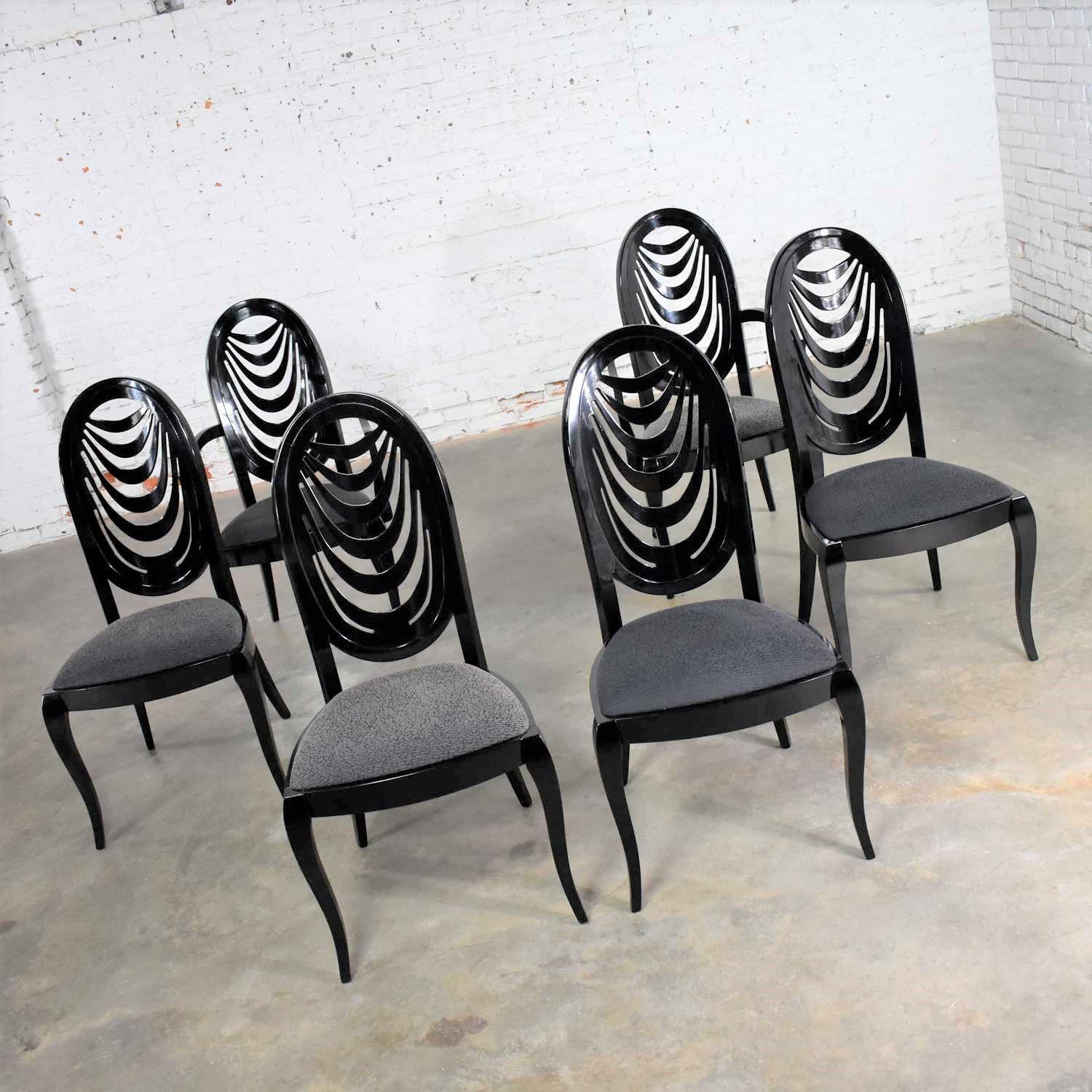 Incredible set of six black lacquer dining chairs with an oval drape back design by Pietro Costantini for Ello. There are four side chairs and two captain’s or armed chairs. They are in wonderful condition. There were age related nicks and dings to